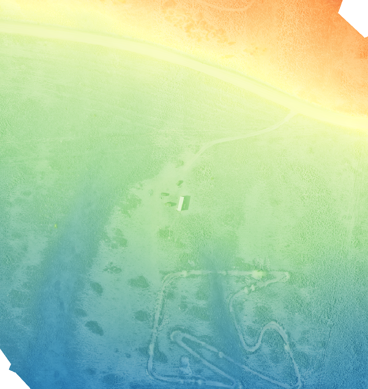 A vibrant, colorful abstract background with a gradient of warm oranges and yellows at the top, transitioning to greens, blues, and purples at the bottom, with subtle textured patterns.