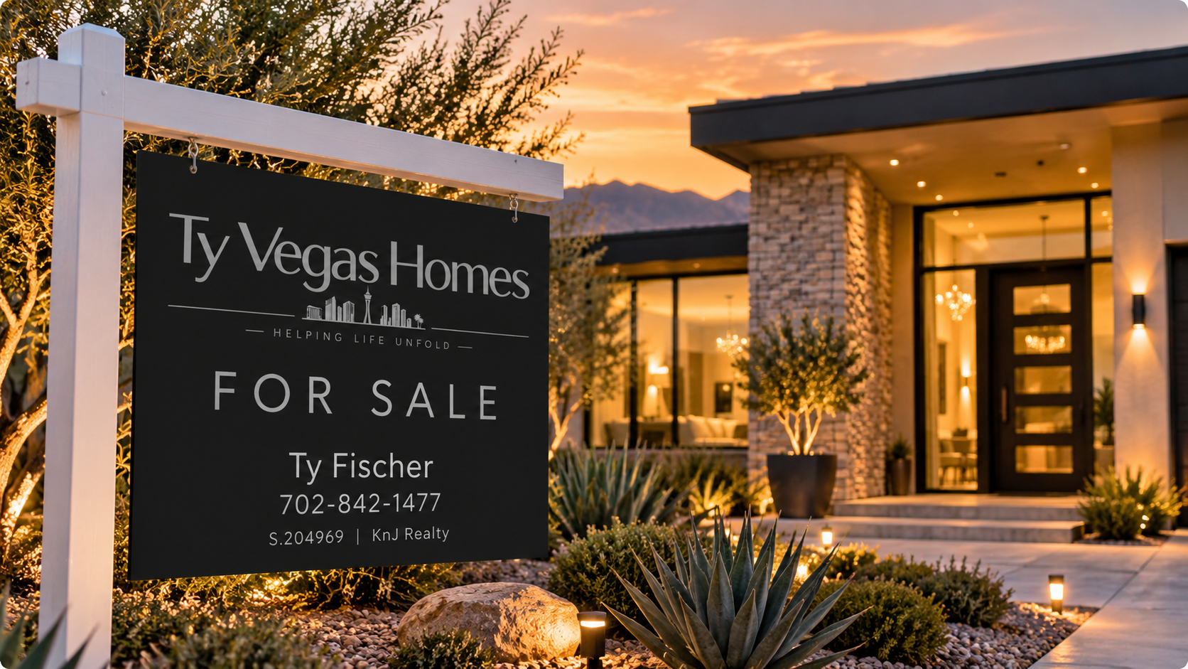 A modern Las Vegas house at sunset with large glass windows and a front porch, decorated with outdoor lighting, plants, and shrubs. A "For Sale" sign from Ty Vegas Homes is in the foreground.