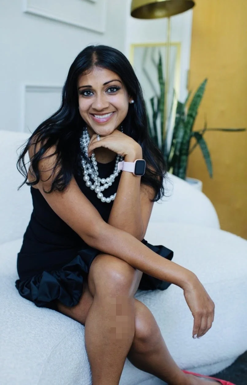 Children's book author Nisha Jain Koria smiling in a bright room