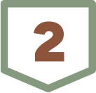 A brown number two on a shield-shaped sign with a green border