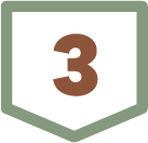 A brown number three on a shield-shaped sign with a green border