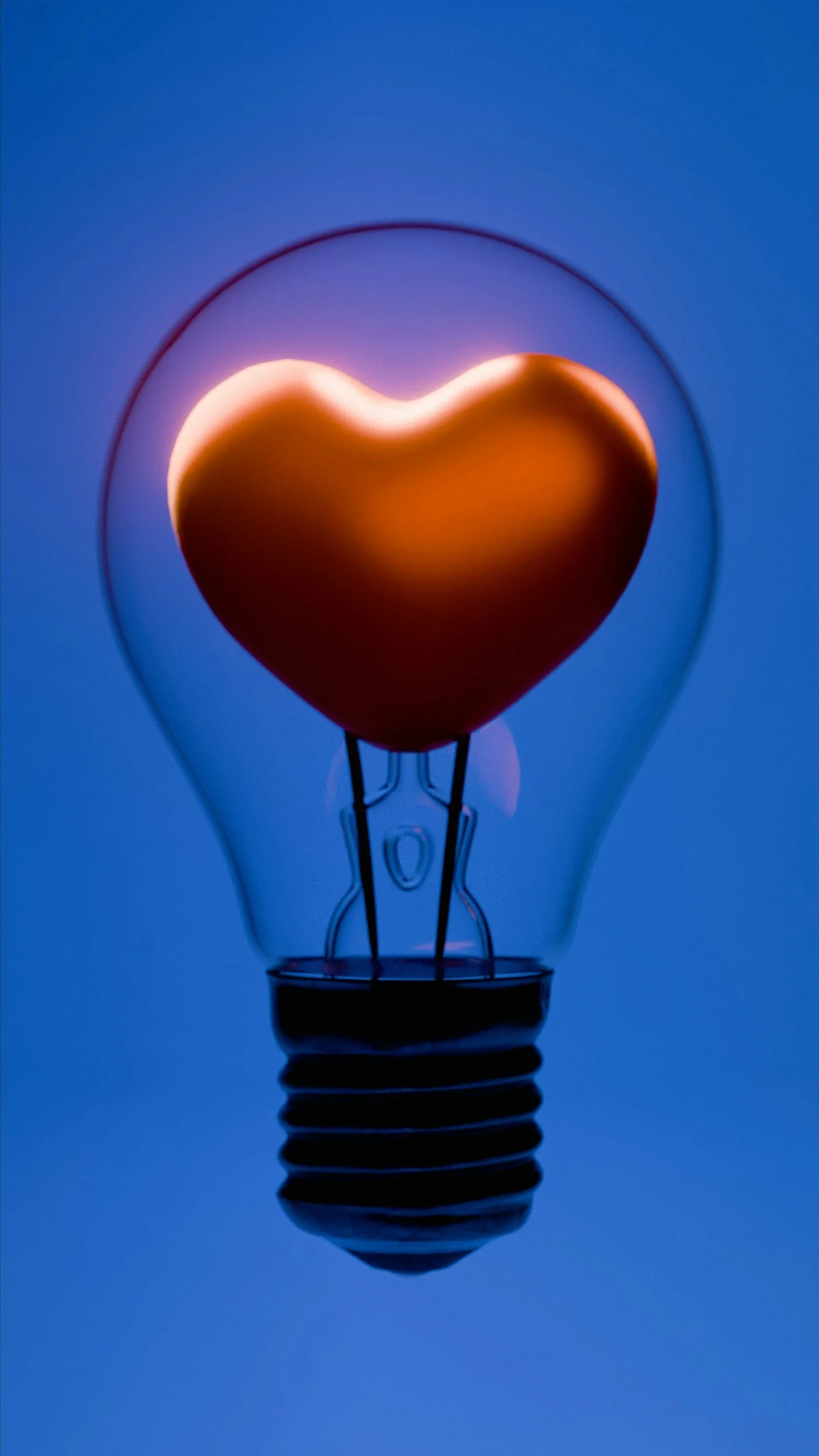 Picture of a lightbulb moment with heart in the lightbulb "what intimacy looks like"