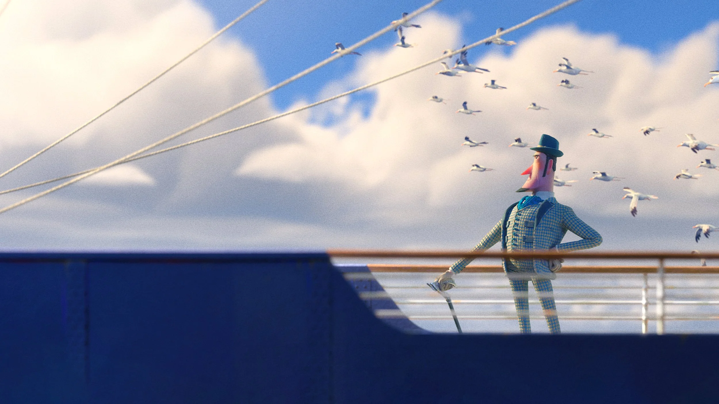 A puppet figure dressed in checked clothing, wearing a blue hat, standing on a ship's deck with a sky filled with flying birds in the background.