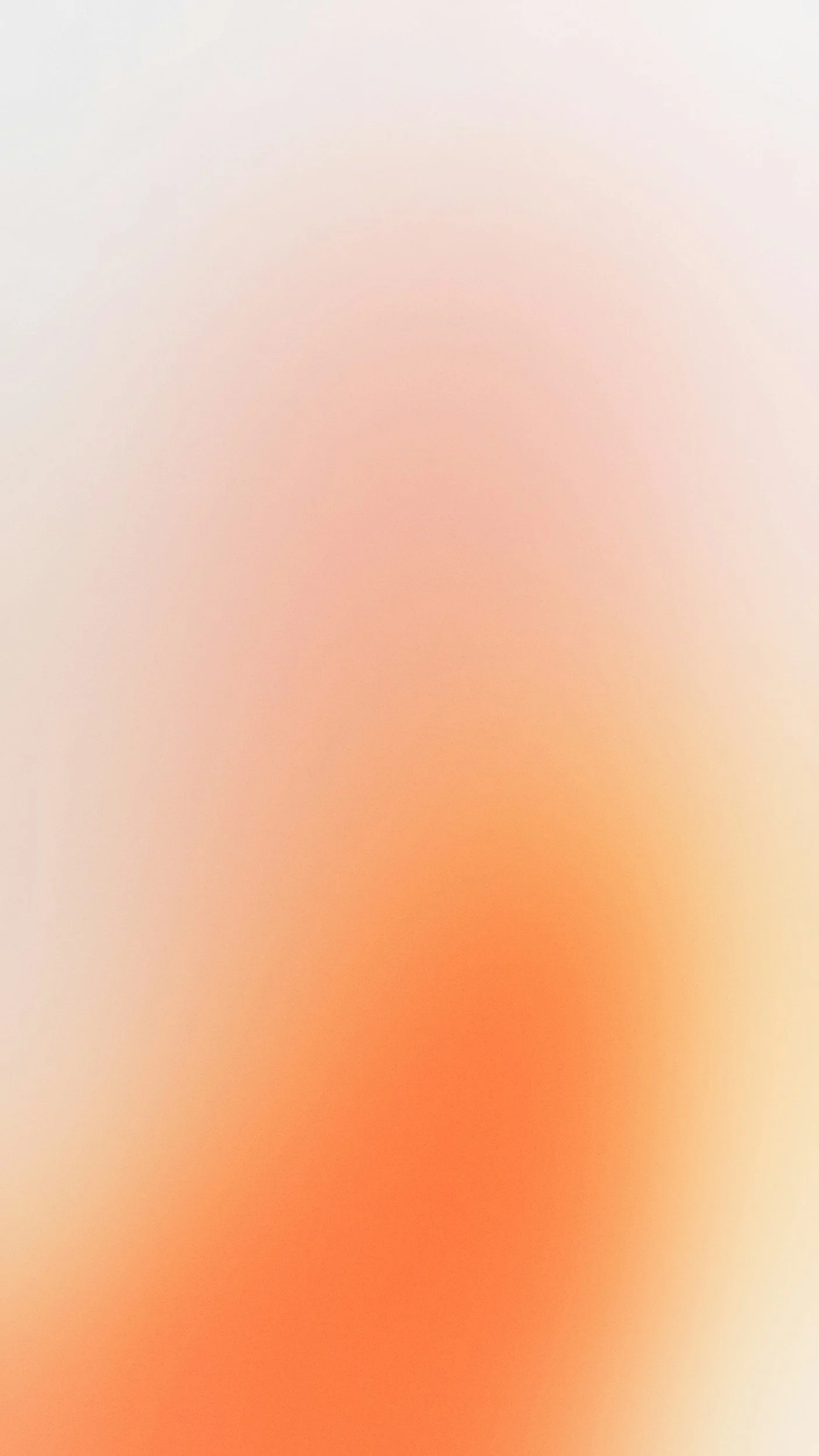 A blurred, abstract background with shades of beige, pink, and orange.