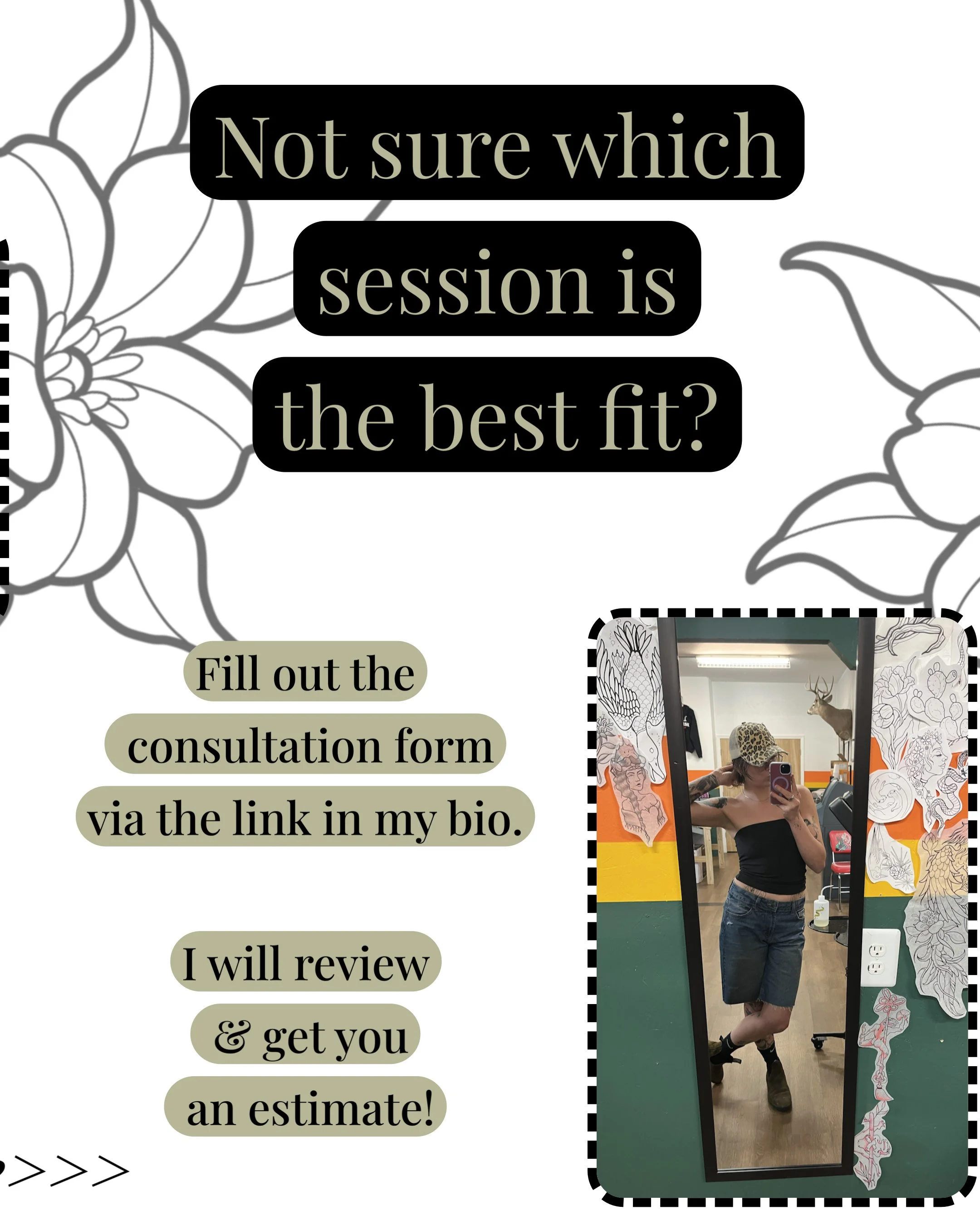 A woman taking a mirror selfie in a room decorated with floral wallpaper features a mounted deer head on the wall, and a colorful striped wall behind her. She is wearing a black top and shorts, and has tattoos on her left arm.