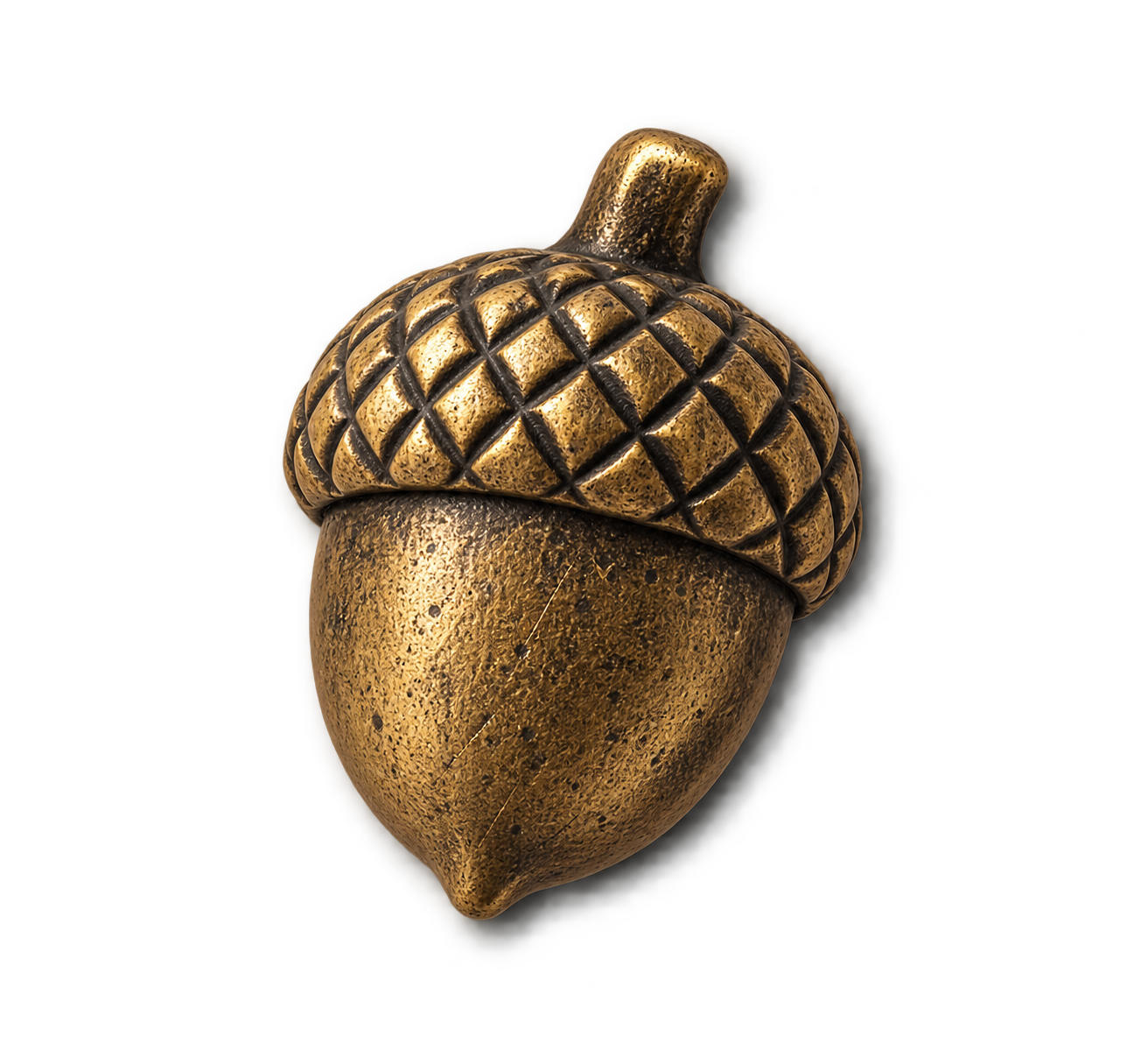 Close-up of a decorative golden acorn with textured surface and a detailed cap, isolated on black background.