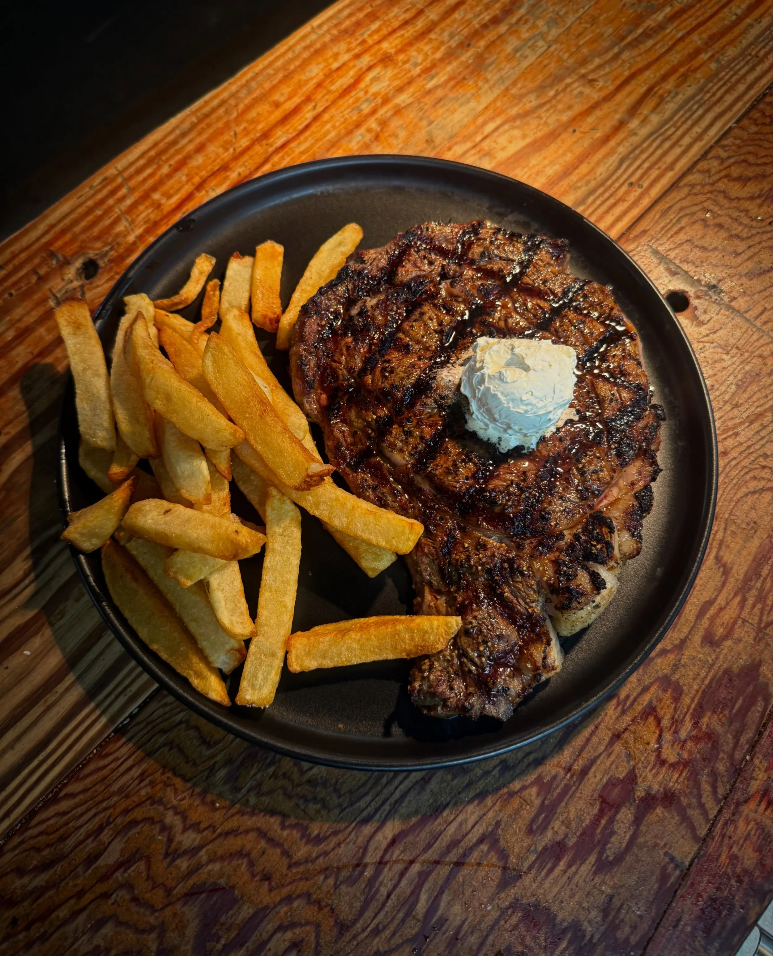 Friday steak night starts at 5pm. Tonight's featured steak is a USDA Prime ribeye coming in at $50 with a side salad and choice of baked potato and fries.