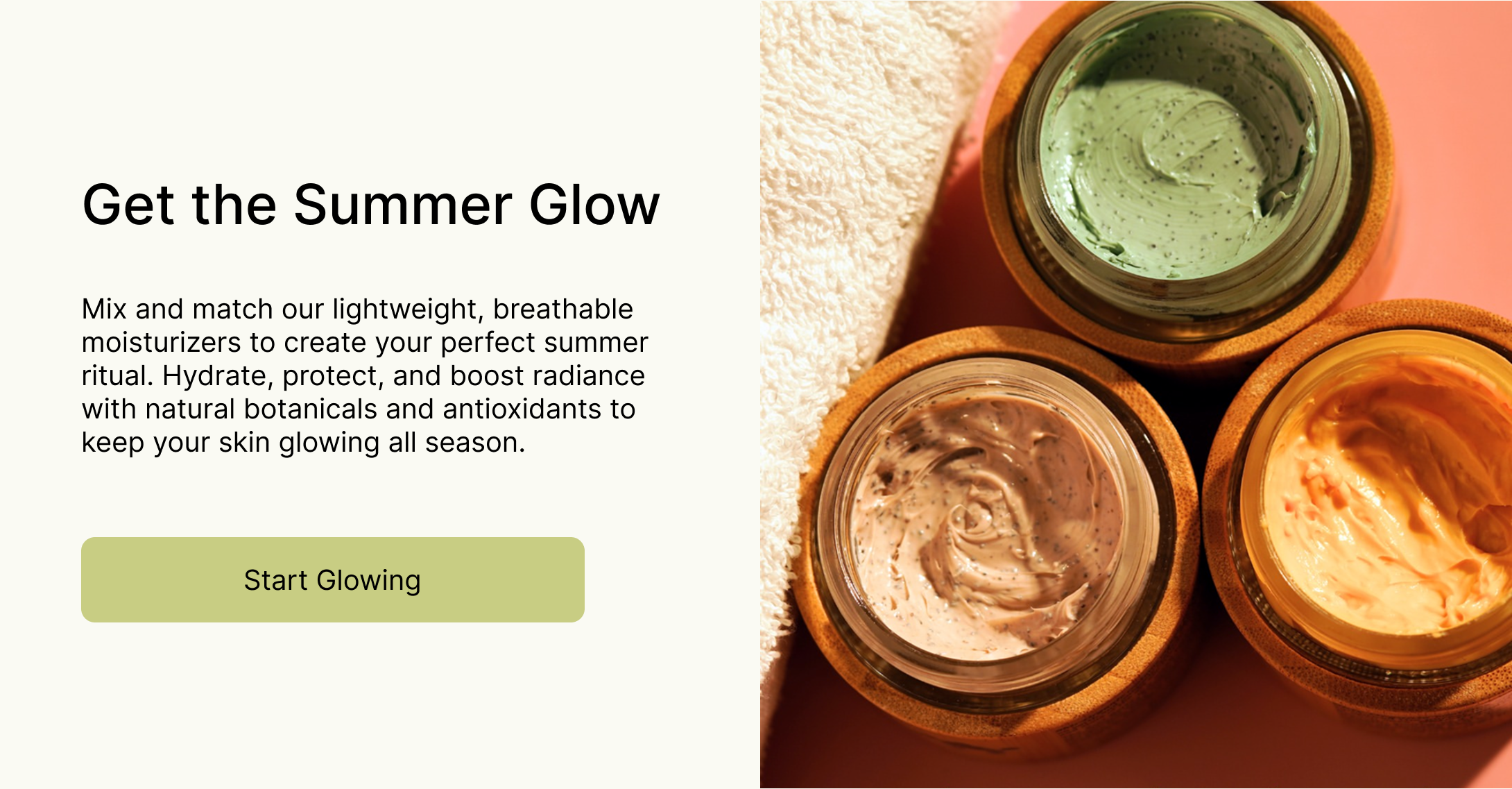 Three jars of textured facial creams in green, beige, and orange shades, placed on a pink background next to a white towel.