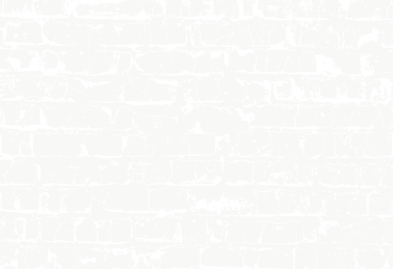 A brick wall with a distressed, peeling paint finish, primarily painted gray with white accents.