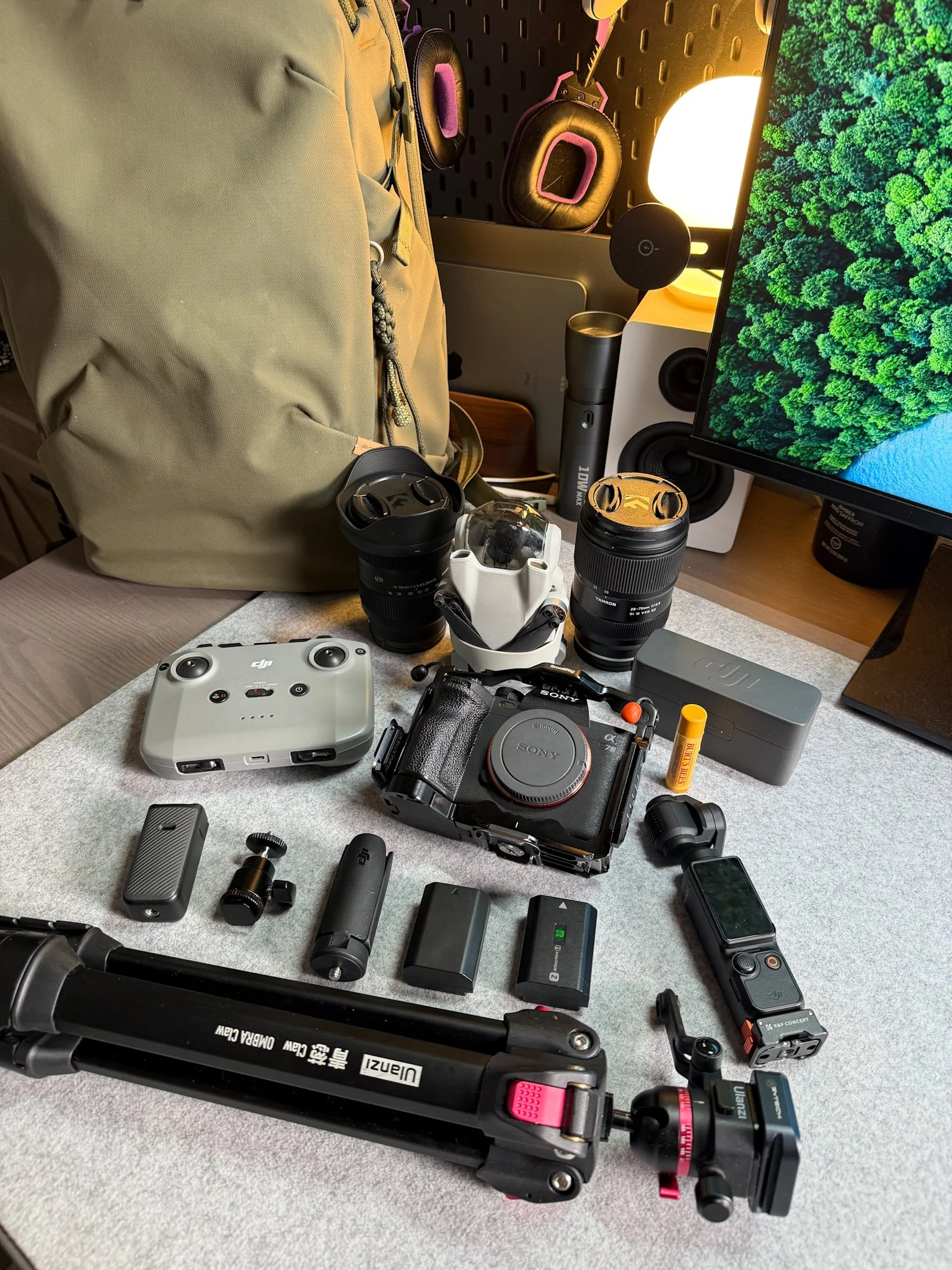 Camera gear and photography equipment arranged on Brad's workspace