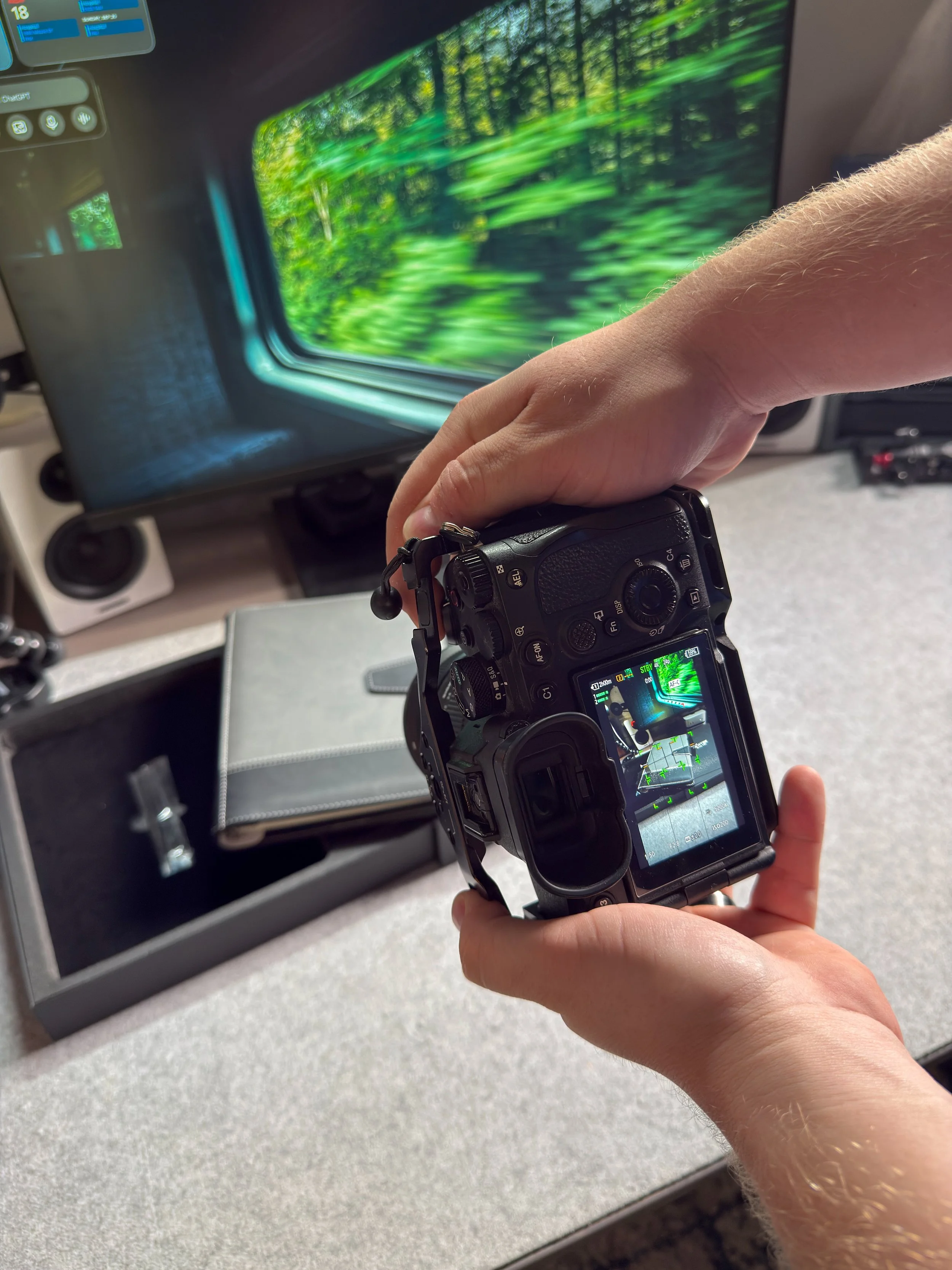 Brad using a camera to capture a photo of a product in a home workspace