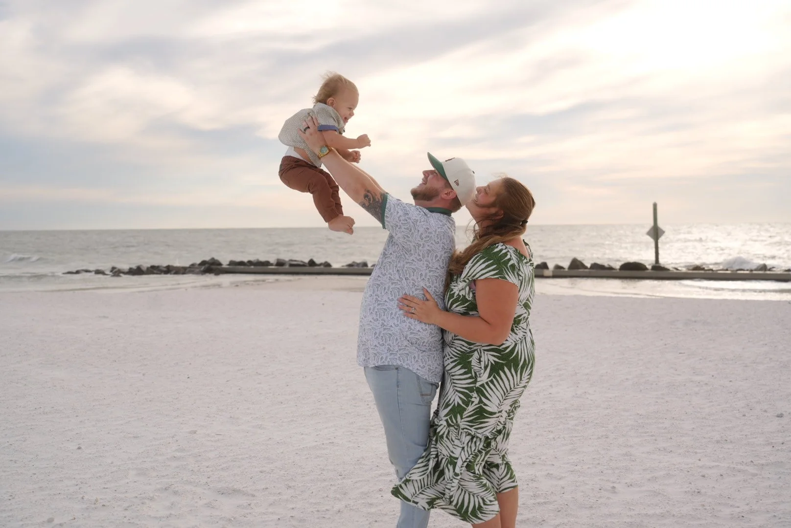 Family of three enjoying a day at the beach at Honeymoon Island Beach in Clearwater Florida