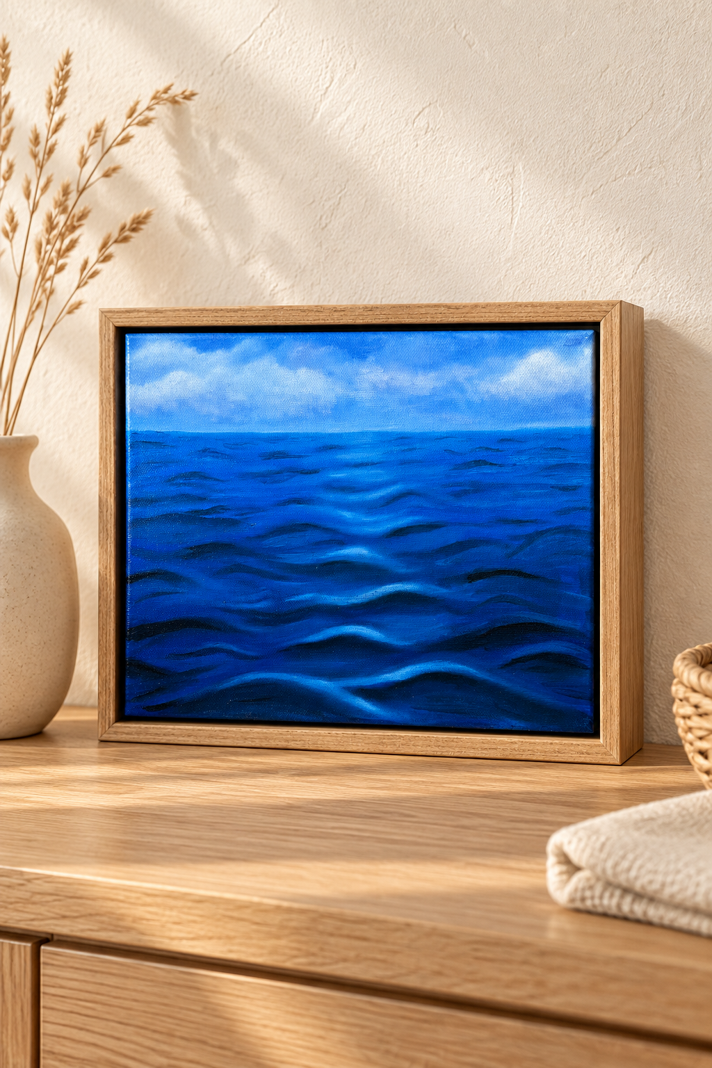 Framed Ocean Painting on Oak Console.png