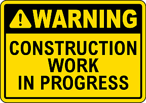 Yellow warning sign with black text stating 'Caution, construction work in progress'.