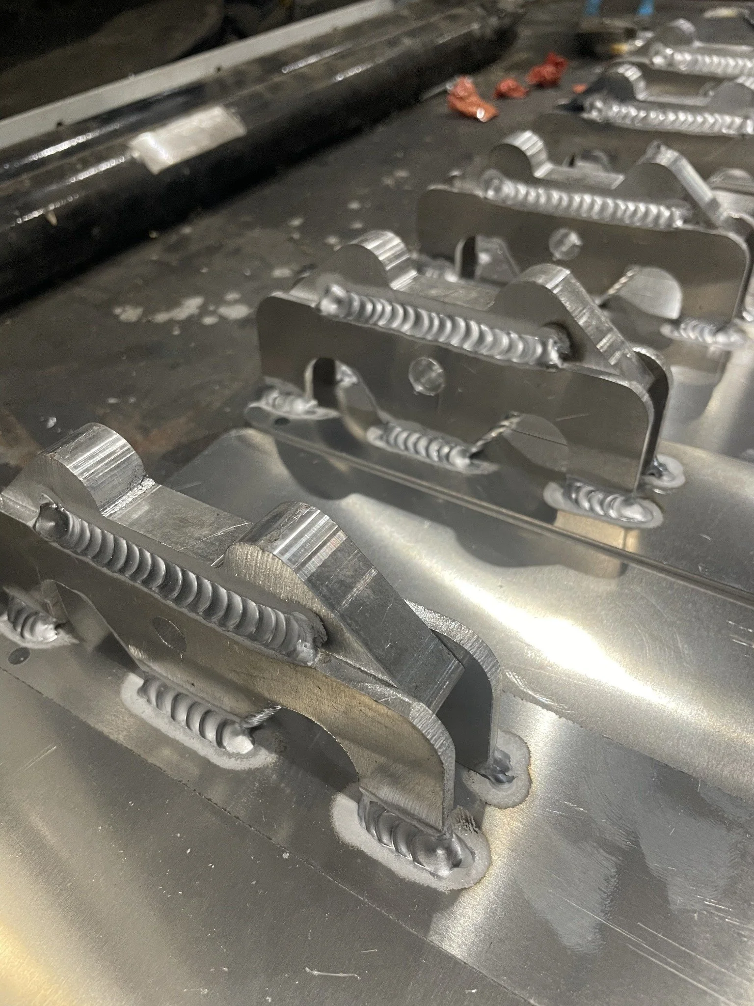 Welded bracket assemblies