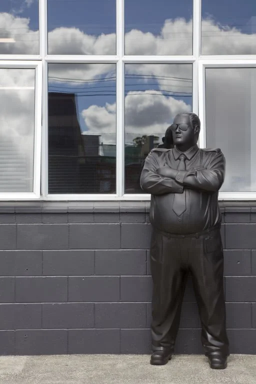 Michael Parekowhai statue in front of large outdoor windows.