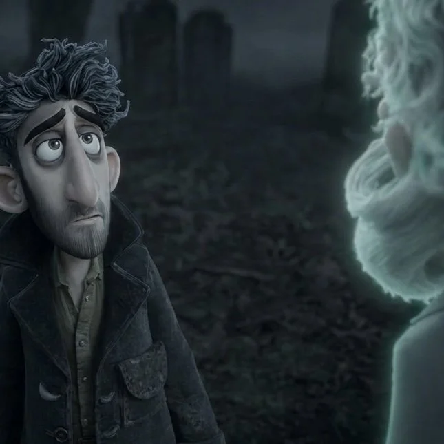 Animated scene of a man with gray hair and beard, wearing a dark jacket, looking up with a sad or worried expression, speaking to a glowing ethereal figure with wispy white hair and beard in a dark, forested background.