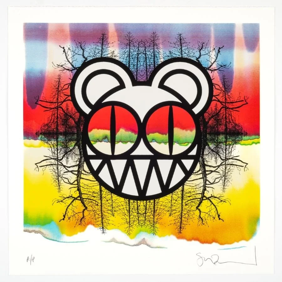 A colorful abstract background with a black outline of a bear's face, overlapping a silhouette of leafless trees, blending natural and artistic elements.