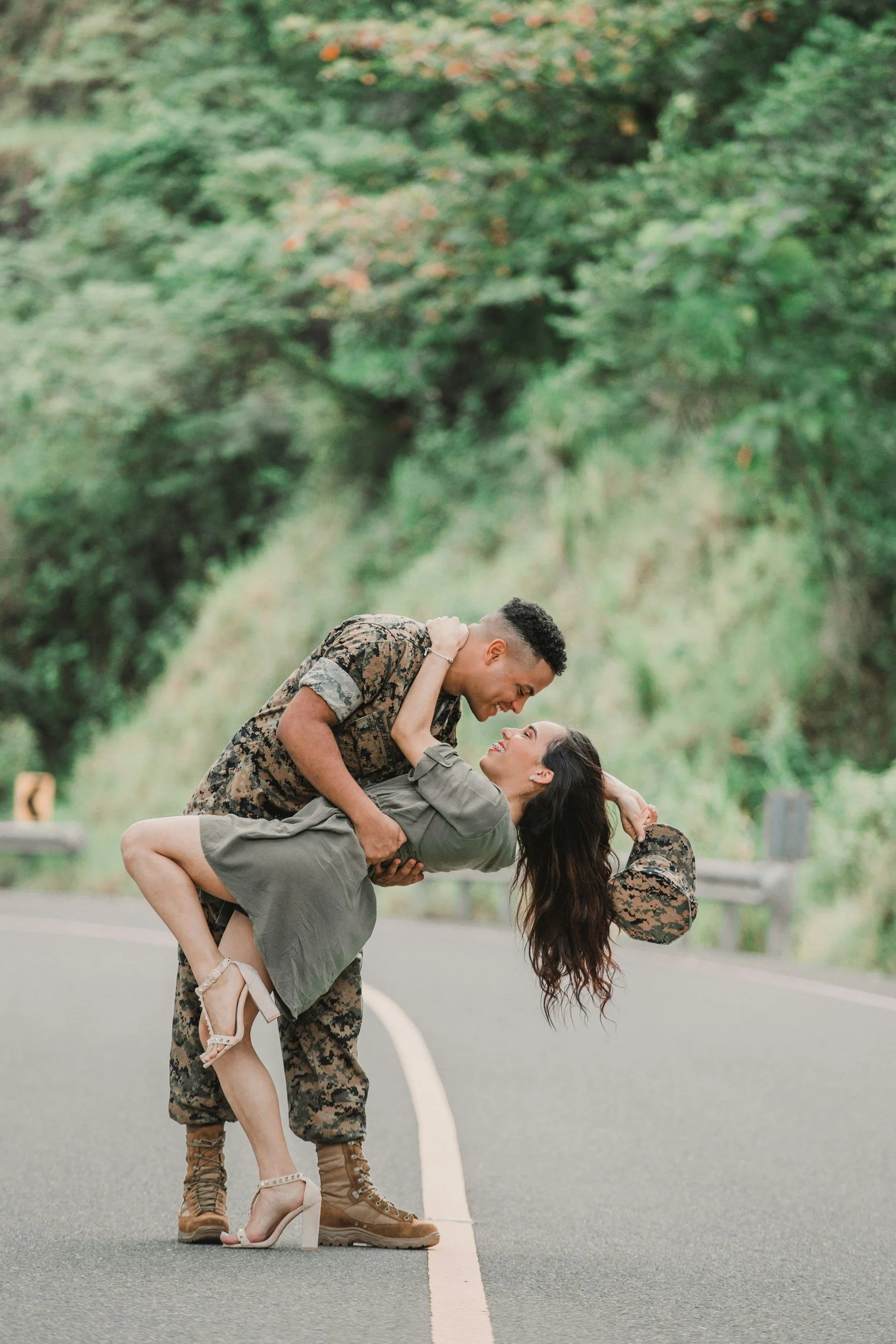 A service member in uniform greeting a loved one during a military homecoming.