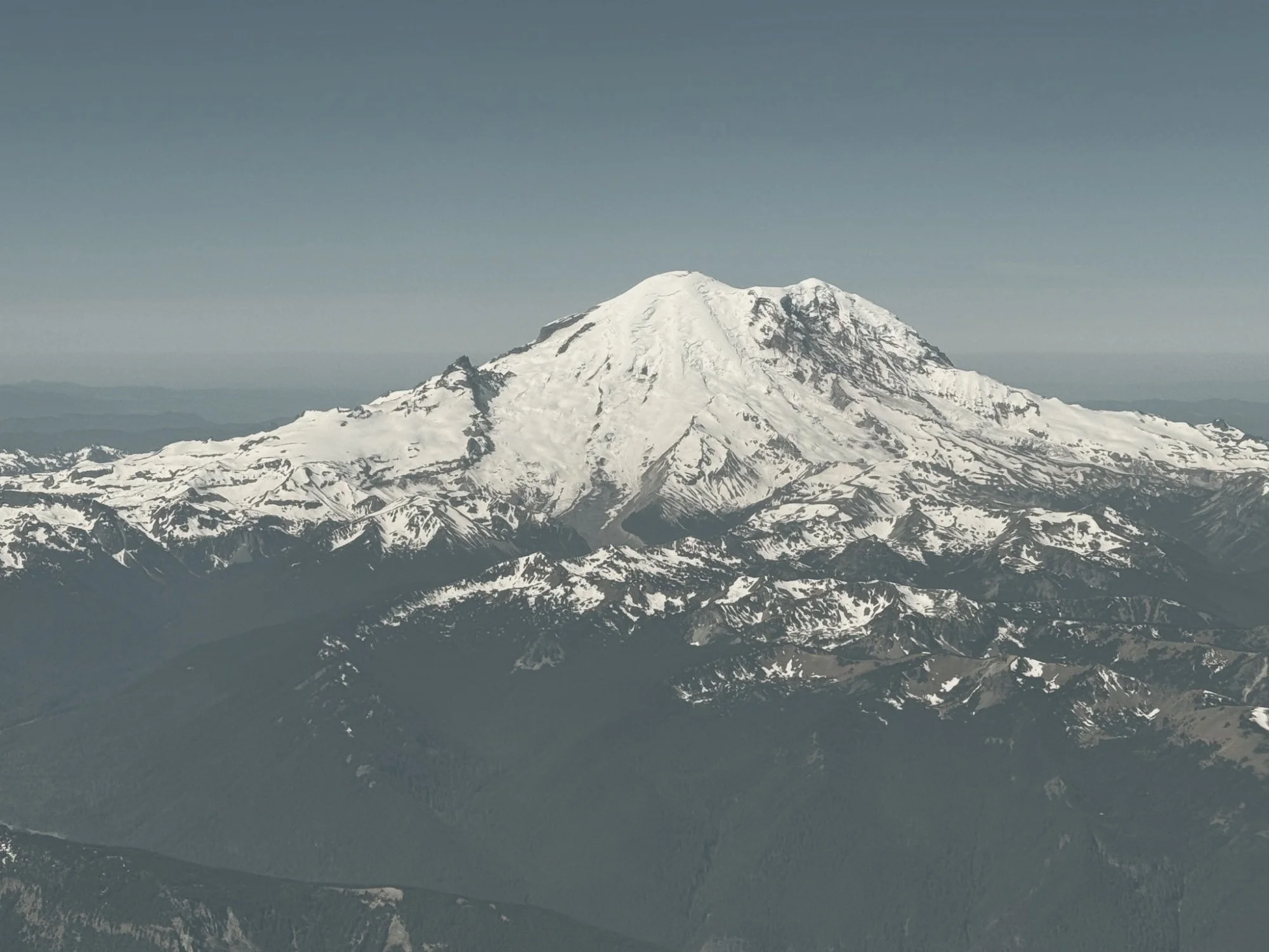 Mount Rainier rising above the clouds on a clear day