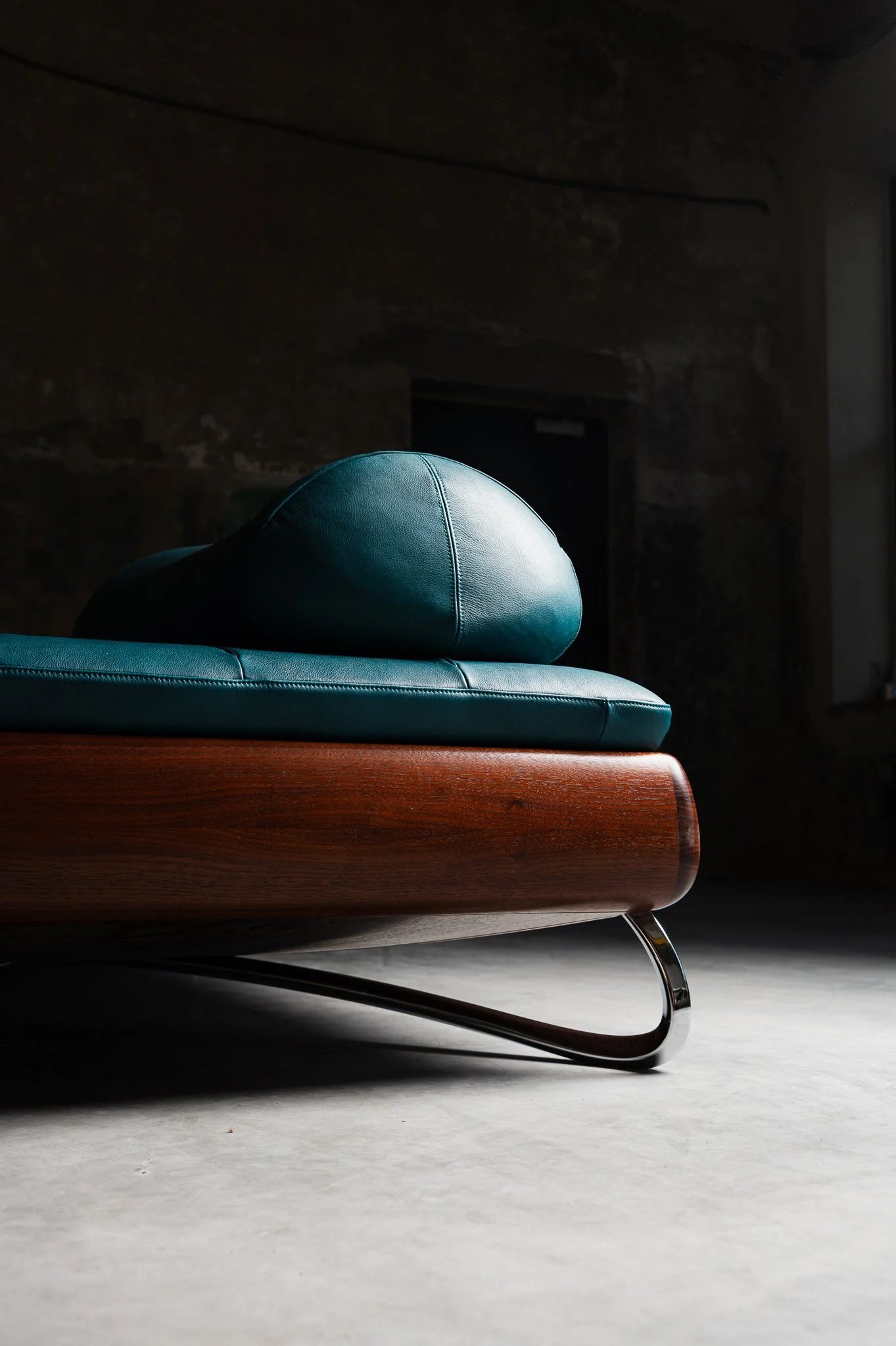 Rosetta Daybed in stained American walnut and full-grain Ocean leather.