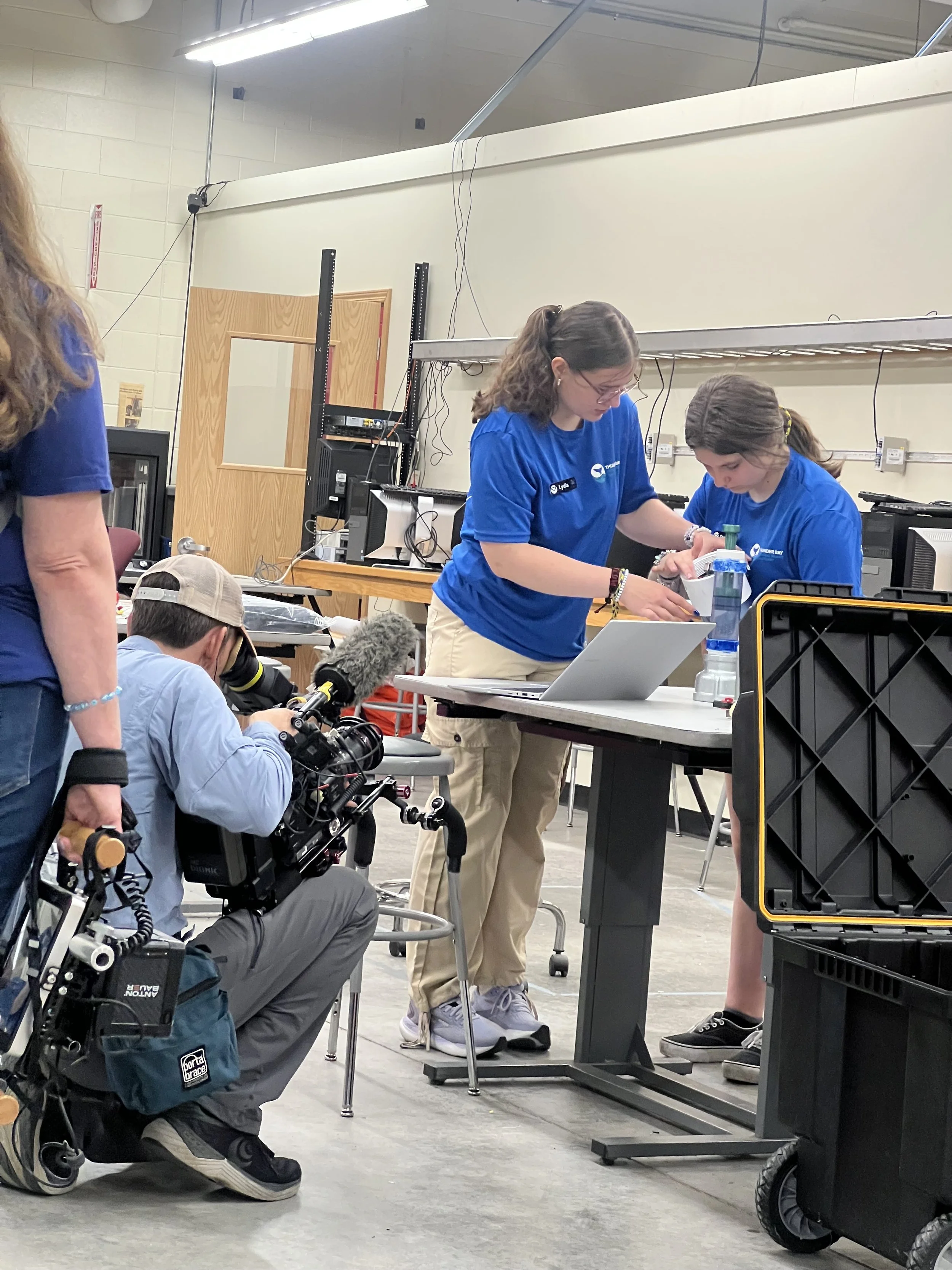 Filming students working on their underwater ROV during the MATE ROV World Championships at Thunder Bay National Marine Sanctuary