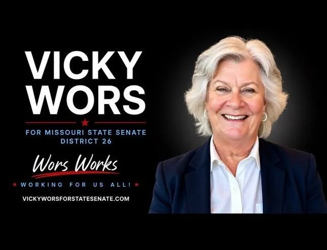 Campaign poster featuring a smiling woman with gray hair in a white shirt and dark blazer, promoting Vicky Wors for Missouri State Senate District 26 with slogans and website.