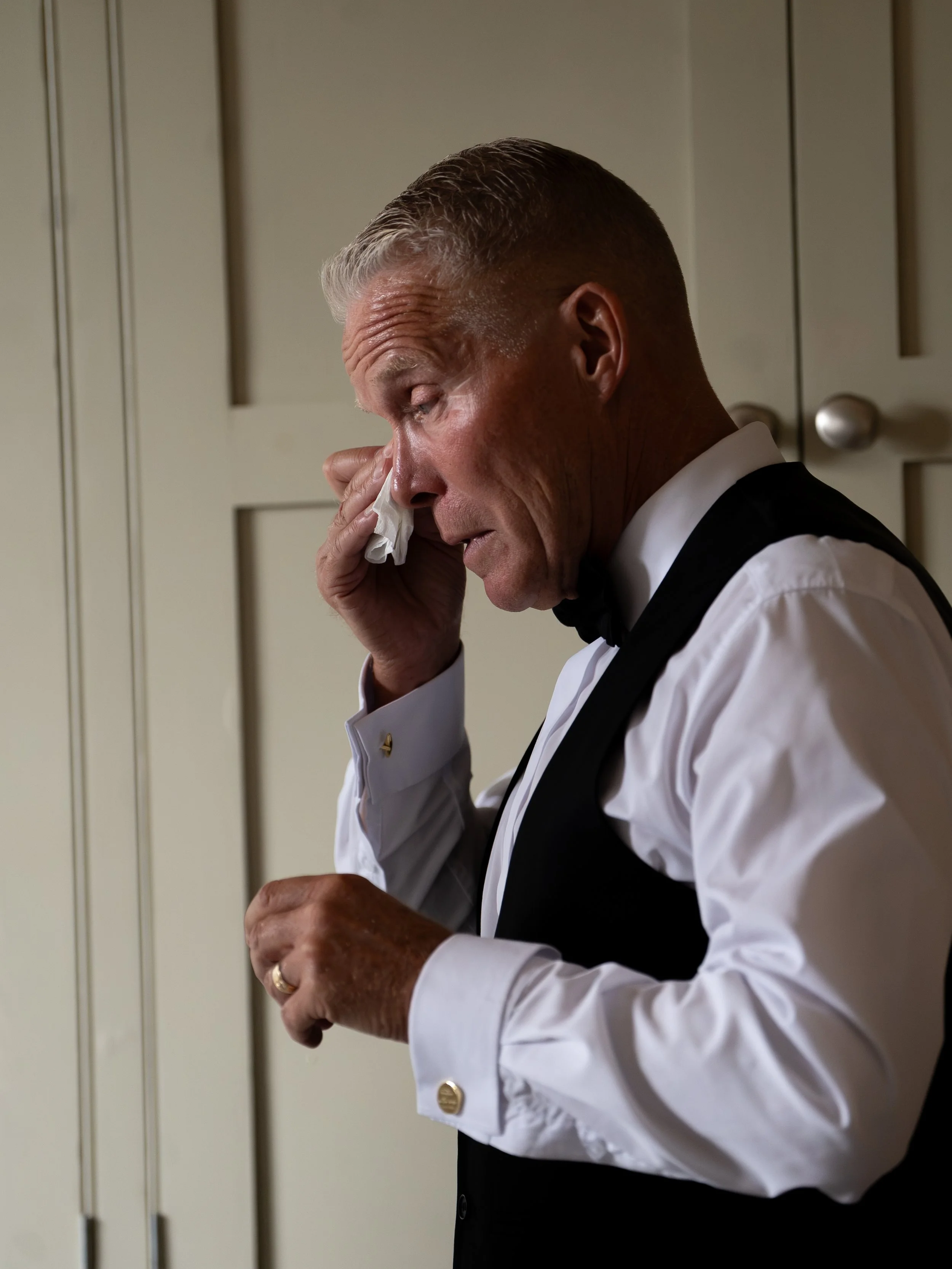 Father of the groom first look expressing emotion