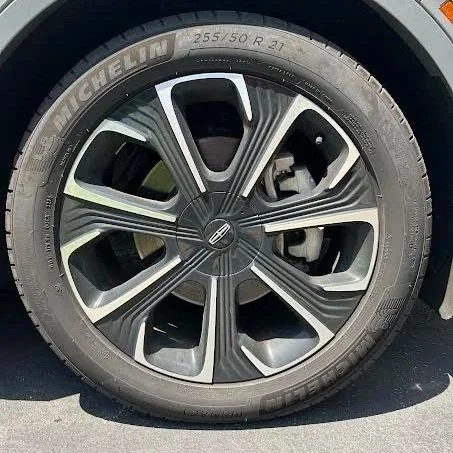 Close-up of a car tire and alloy wheel with Michelin branding