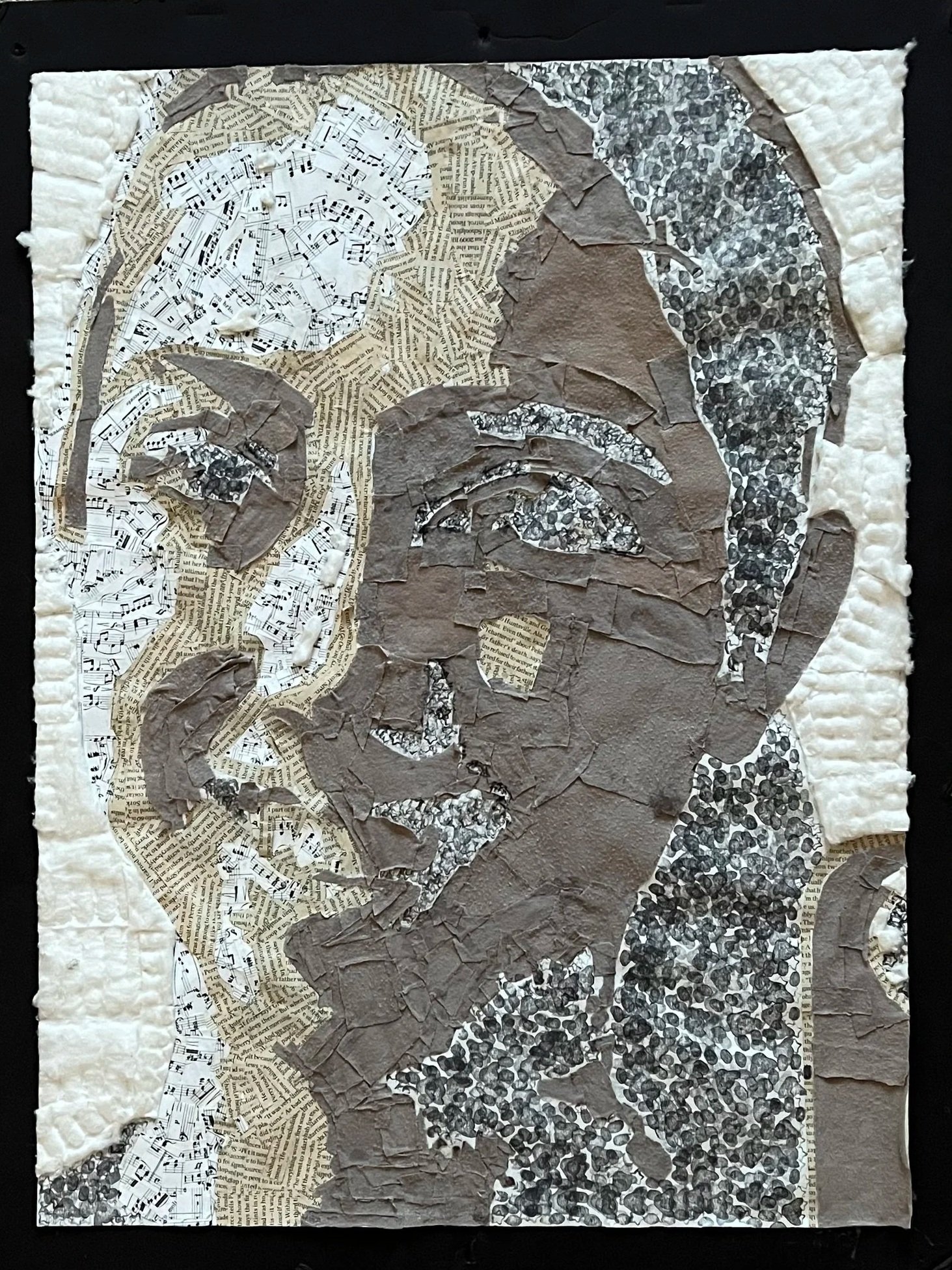 A mosaic portrait of a woman with an elegant hairstyle, created with torn pages from books and musical scores, assembled on a textured white background.