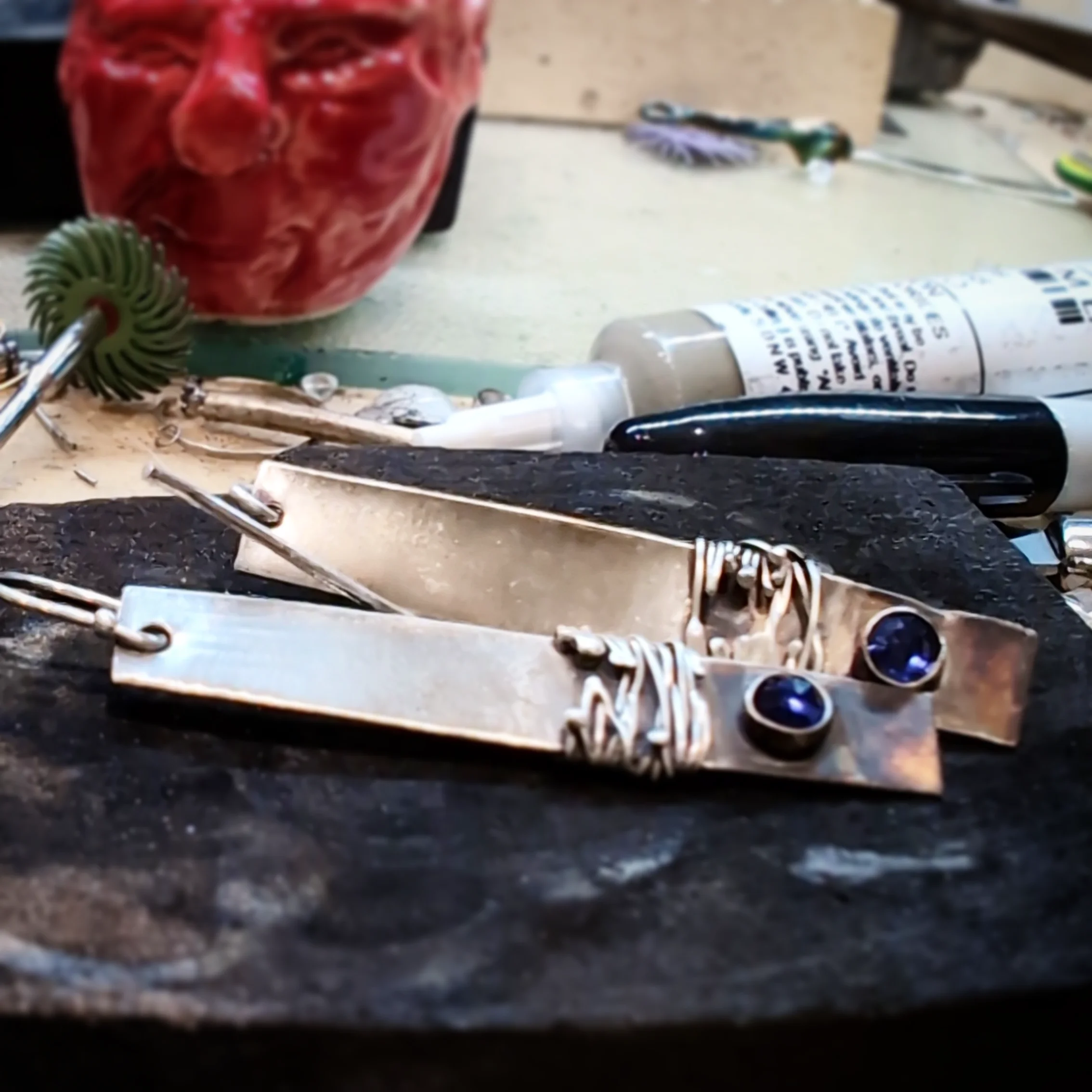 Bar Earrings Featuring Wire wrapped Details And Bezel Set Sapphires 