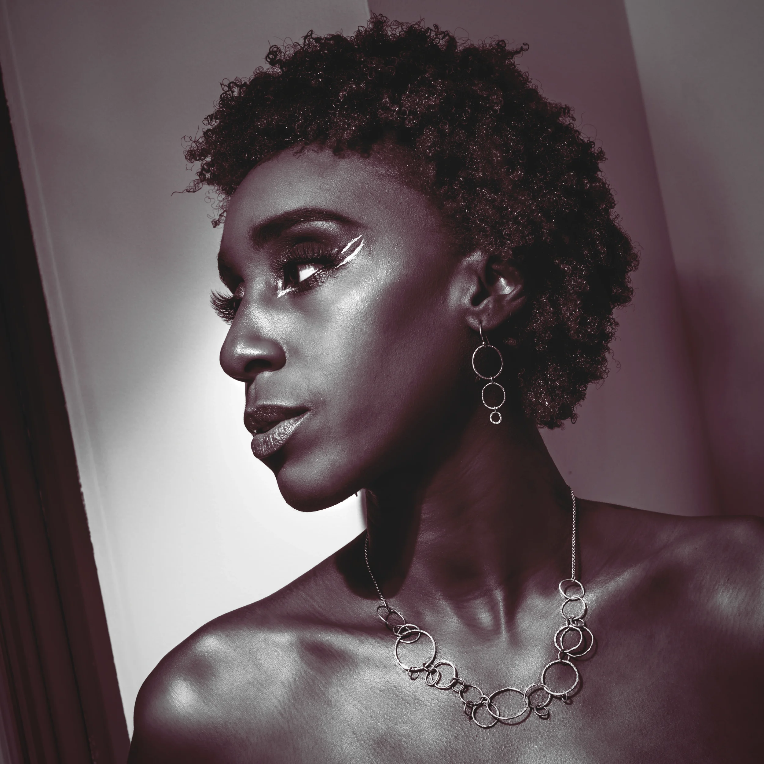 A Model Wearing ZoePea Earrings and A Circle Cluster Necklace