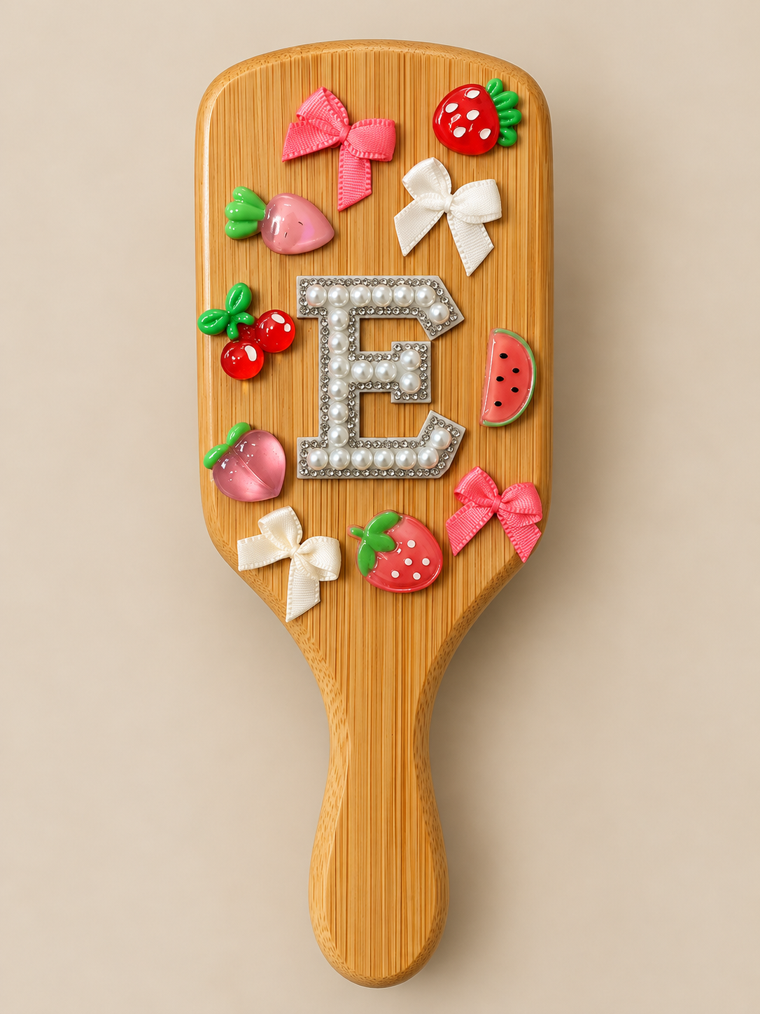 A bamboo hair brush adored with decorations.