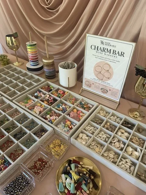 A close-up photo of the charm bar display where guests can create custom wine markers.