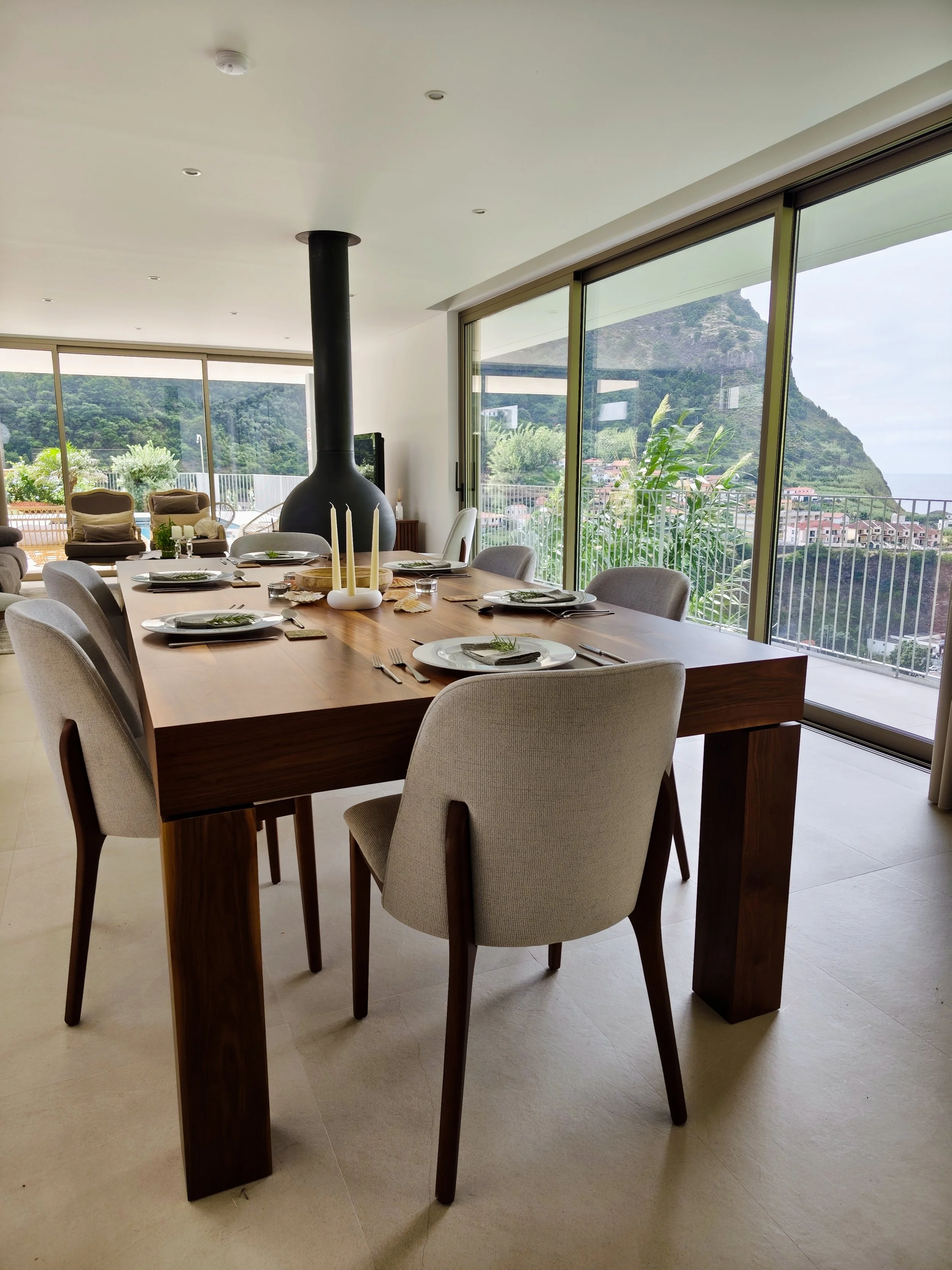 Private dining table set in a bright room overlooking the mountains