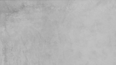 A plain, light gray, concrete or wall surface with slight texture