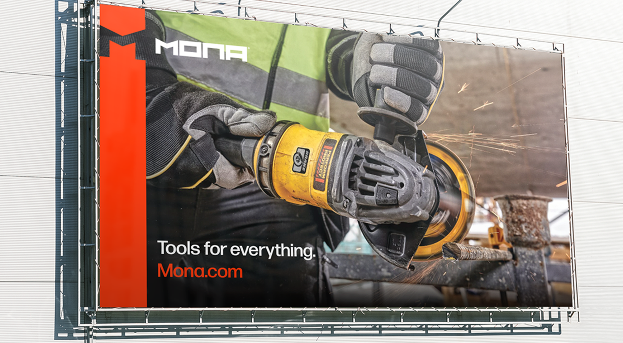 Mona billboard advertising tools, featuring a gloved worker using a yellow angle grinder on metal with sparks flying.