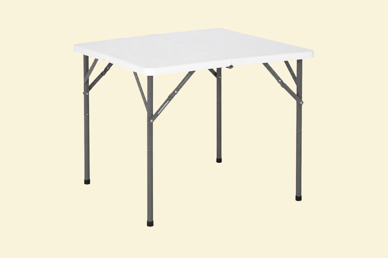 A portable folding table with a white plastic top and metal legs