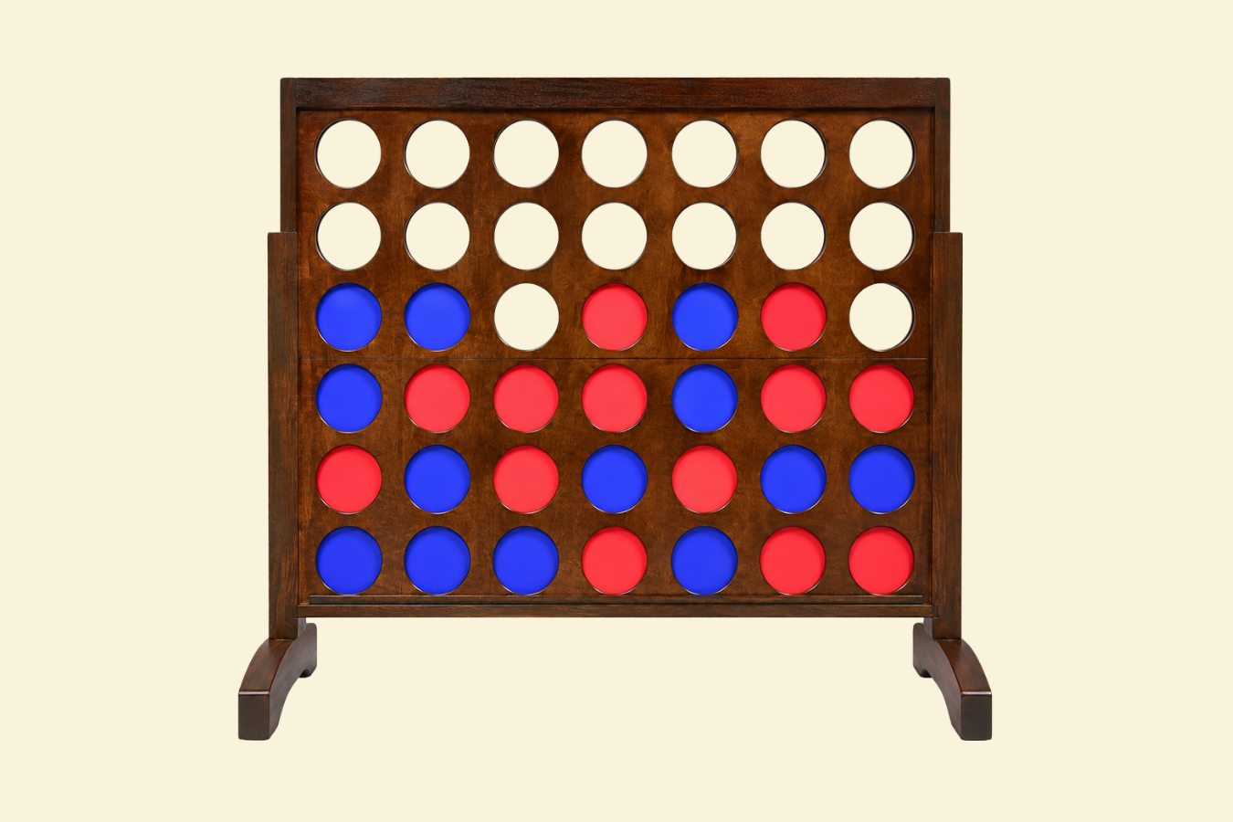 A wooden Connect Four game board with red and blue game pieces in play.