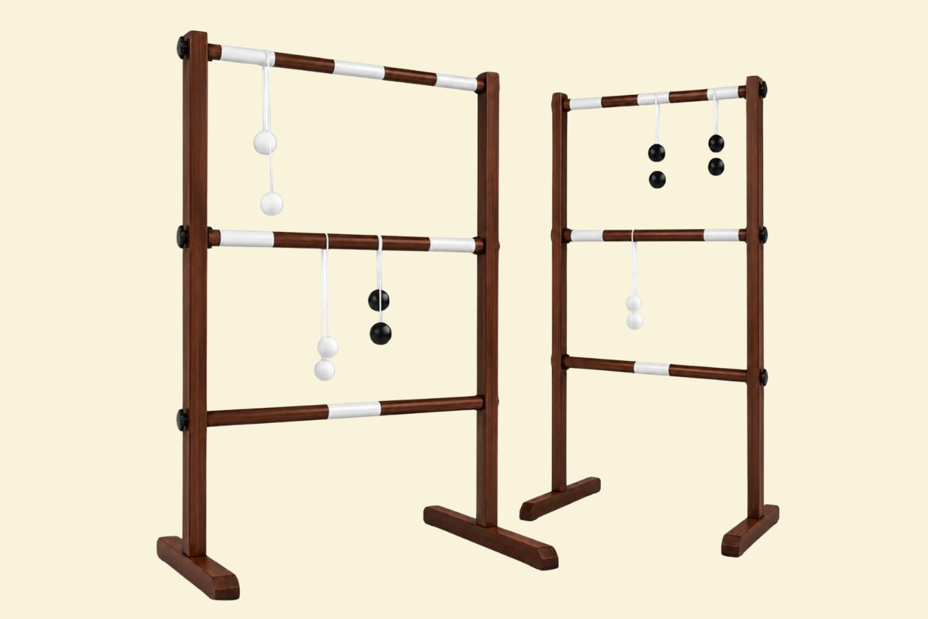 A wooden indoor game set with white and black balls and sticks.