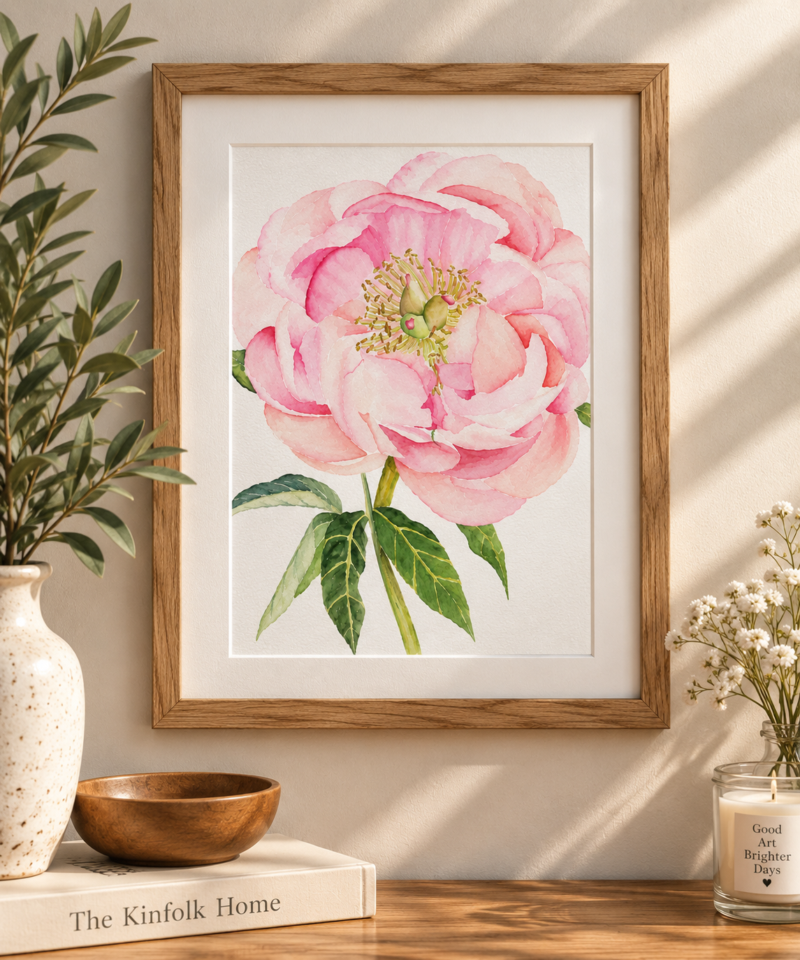 Framed Blushing Peony 5x7 watercolor art print displayed on a warm neutral wall in a natural wood frame with soft botanical home décor.