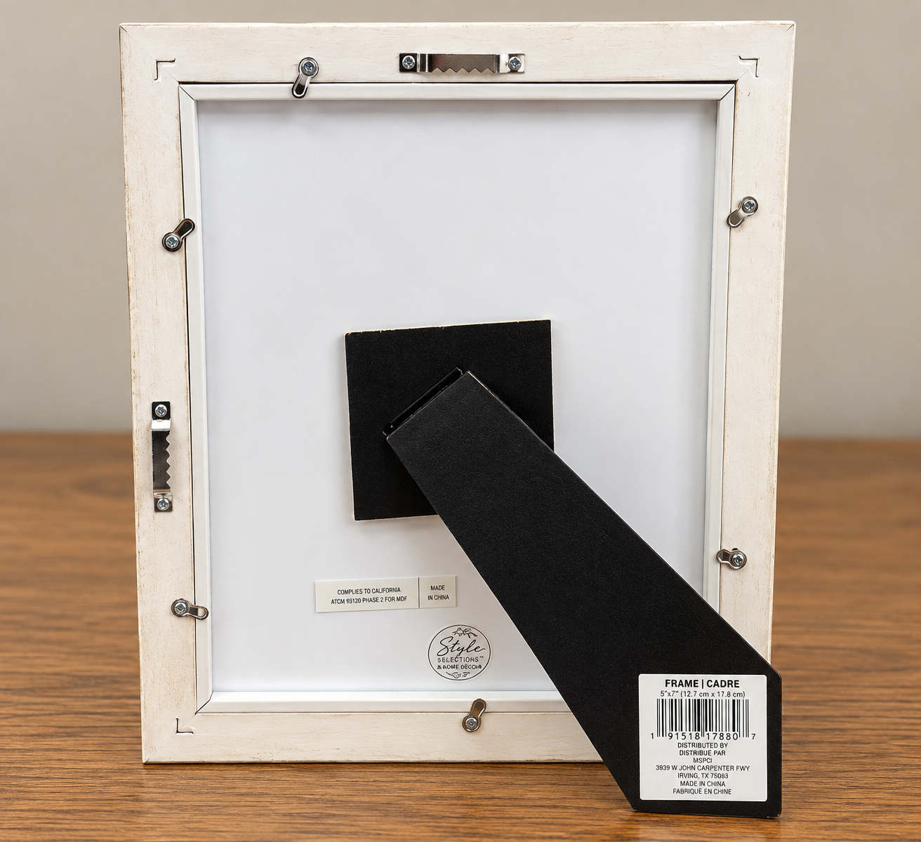 Back of the Under the Coneflower 8x10 distressed ivory frame showing the black easel stand, frame fasteners, and wall-hanging hardware.