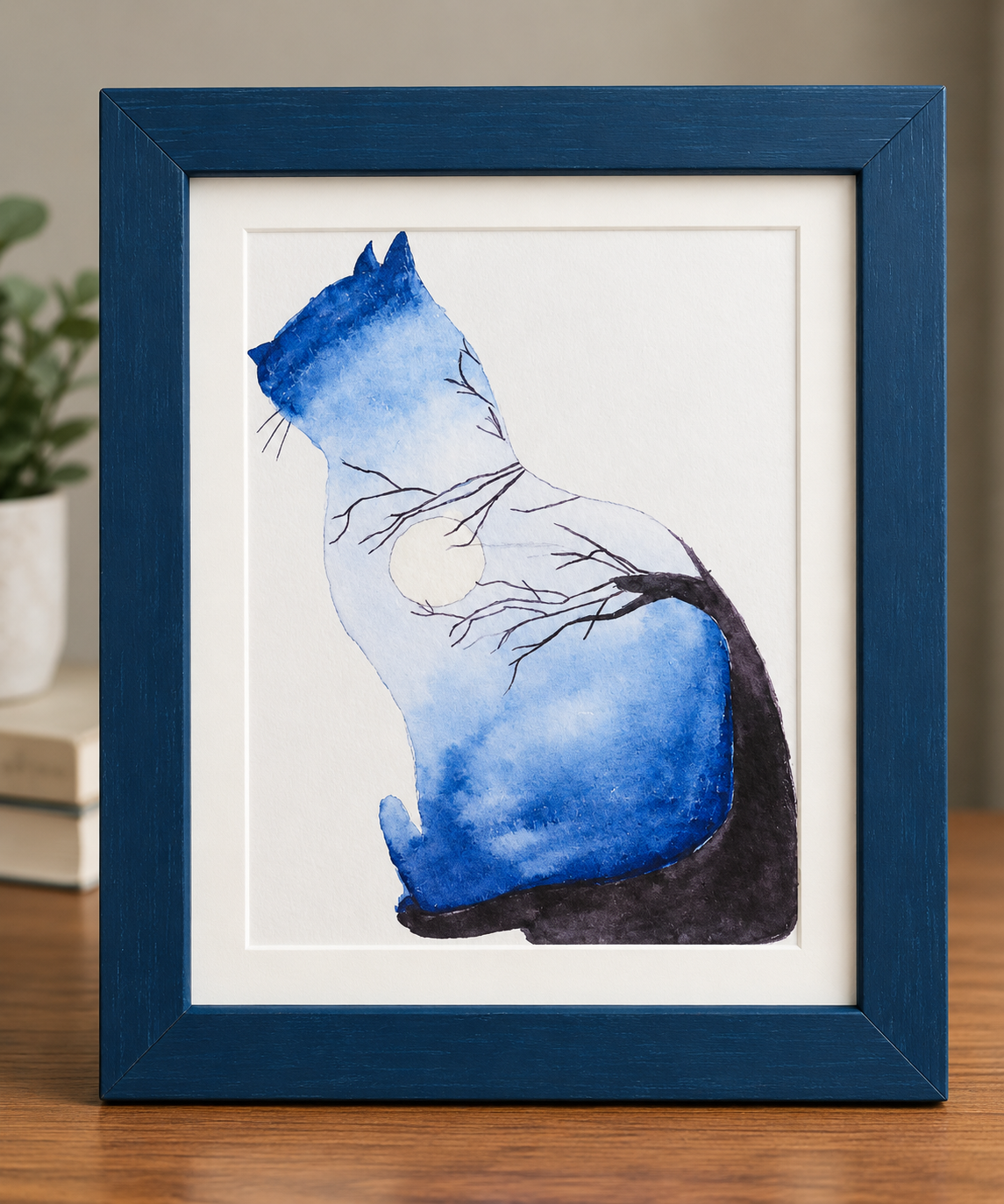 Blue Whiskers 5x7 watercolor print featuring a seated blue cat silhouette with delicate tree branches and a pale moon, displayed in a blue 8x10 frame.