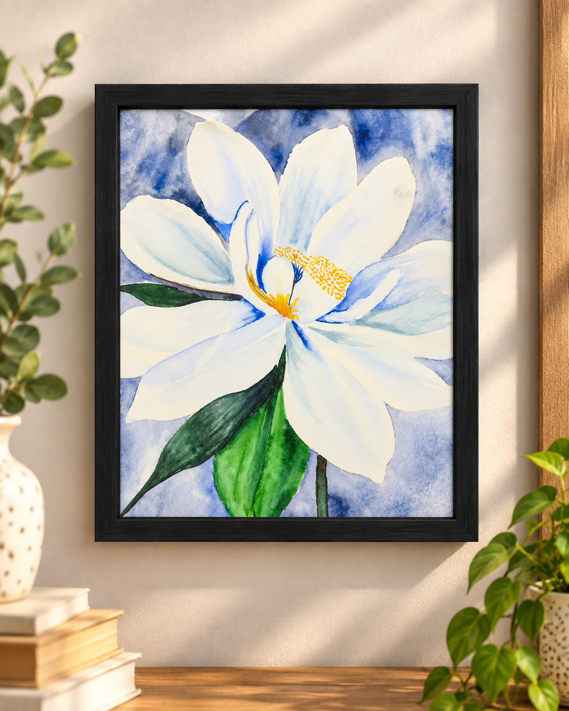 Moonlight in Magnolia 8x10 framed botanical print displayed on a wall, featuring a white magnolia watercolor in soft blue and green tones.