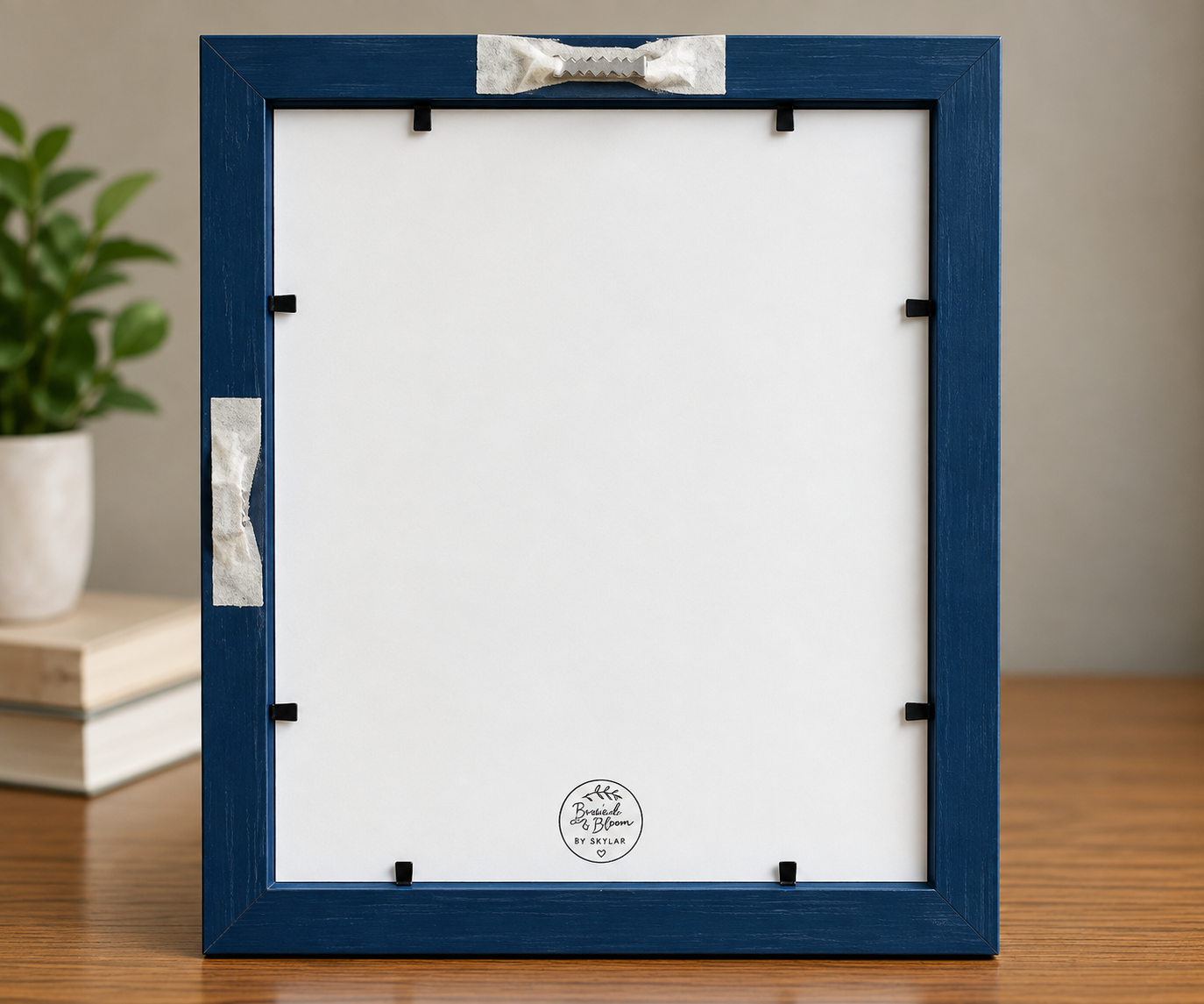 Back of the Blue Whiskers 8x10 blue frame showing the white backing, black frame fasteners, and sawtooth wall-hanging hardware.