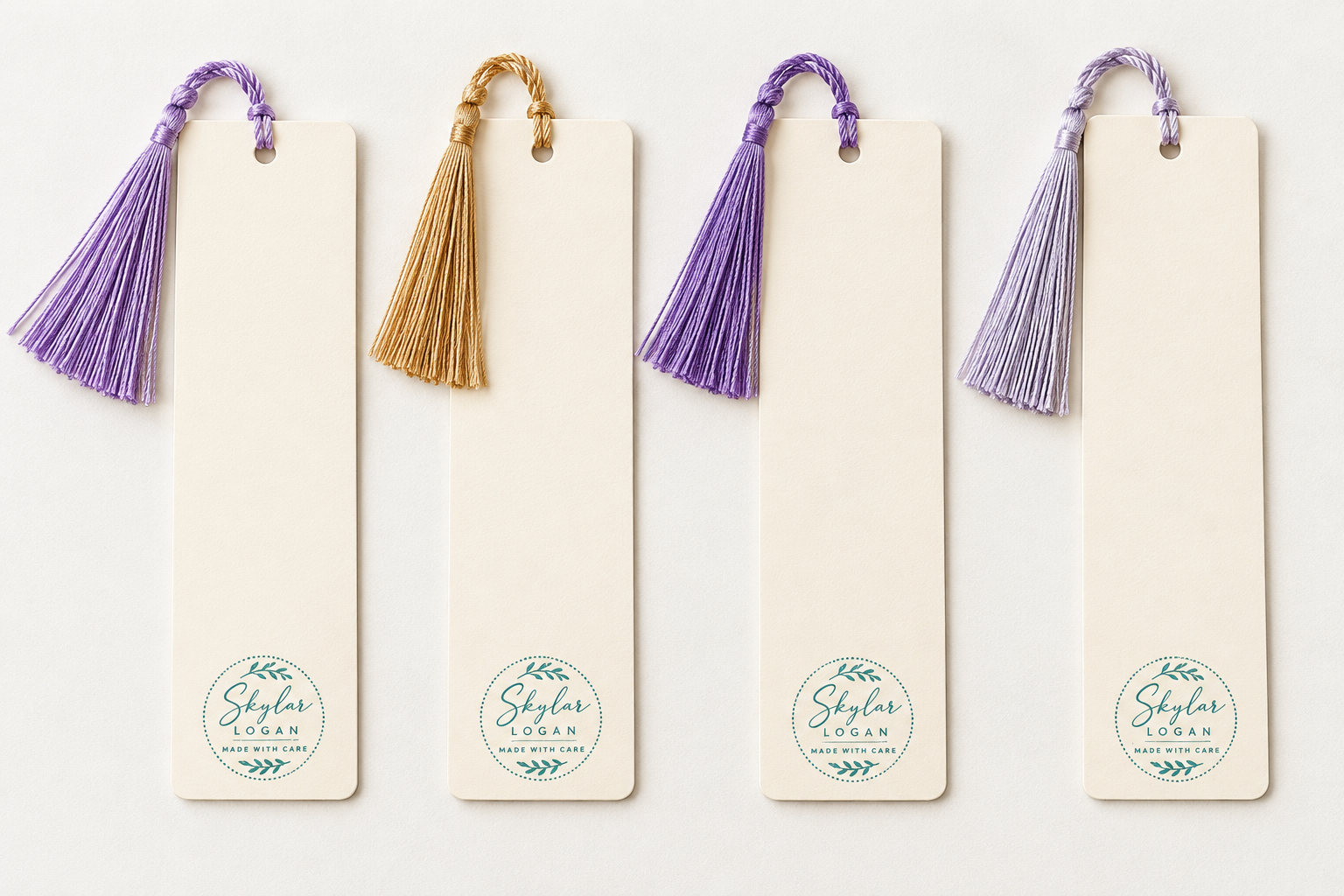 Backs of 5.5 by 2 inch watercolor chicken bookmarks showing cream paper, coordinating tassels, and Skylar Logan artist branding.