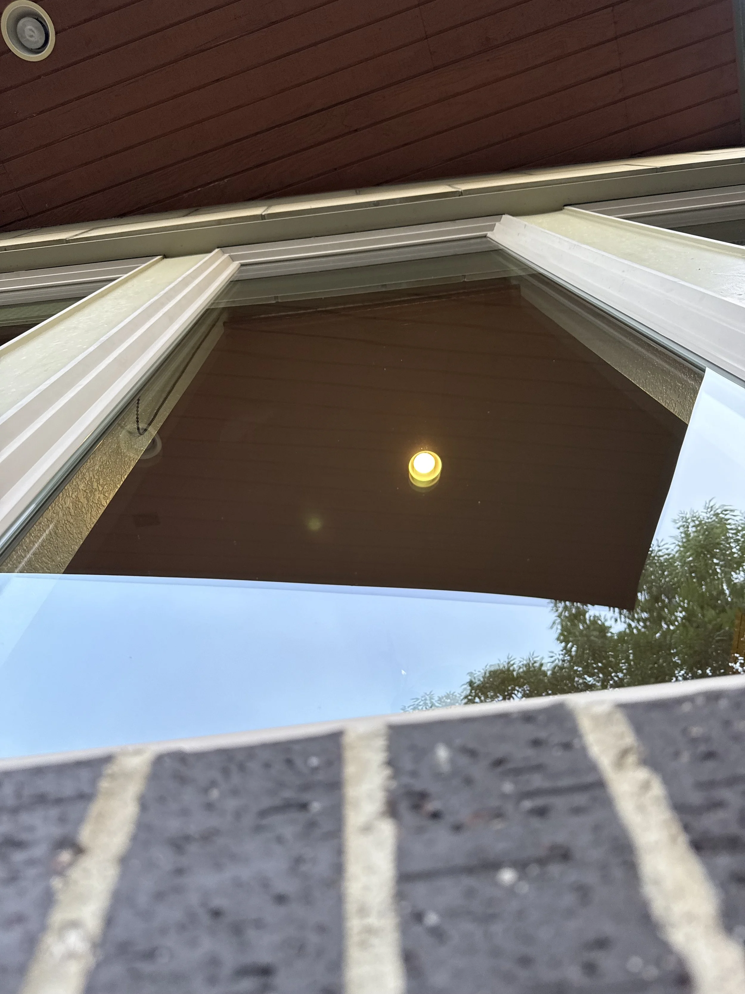 Residential window serviced by Reflect Window Cleaning (RWC) as part of professional interior and exterior window cleaning.