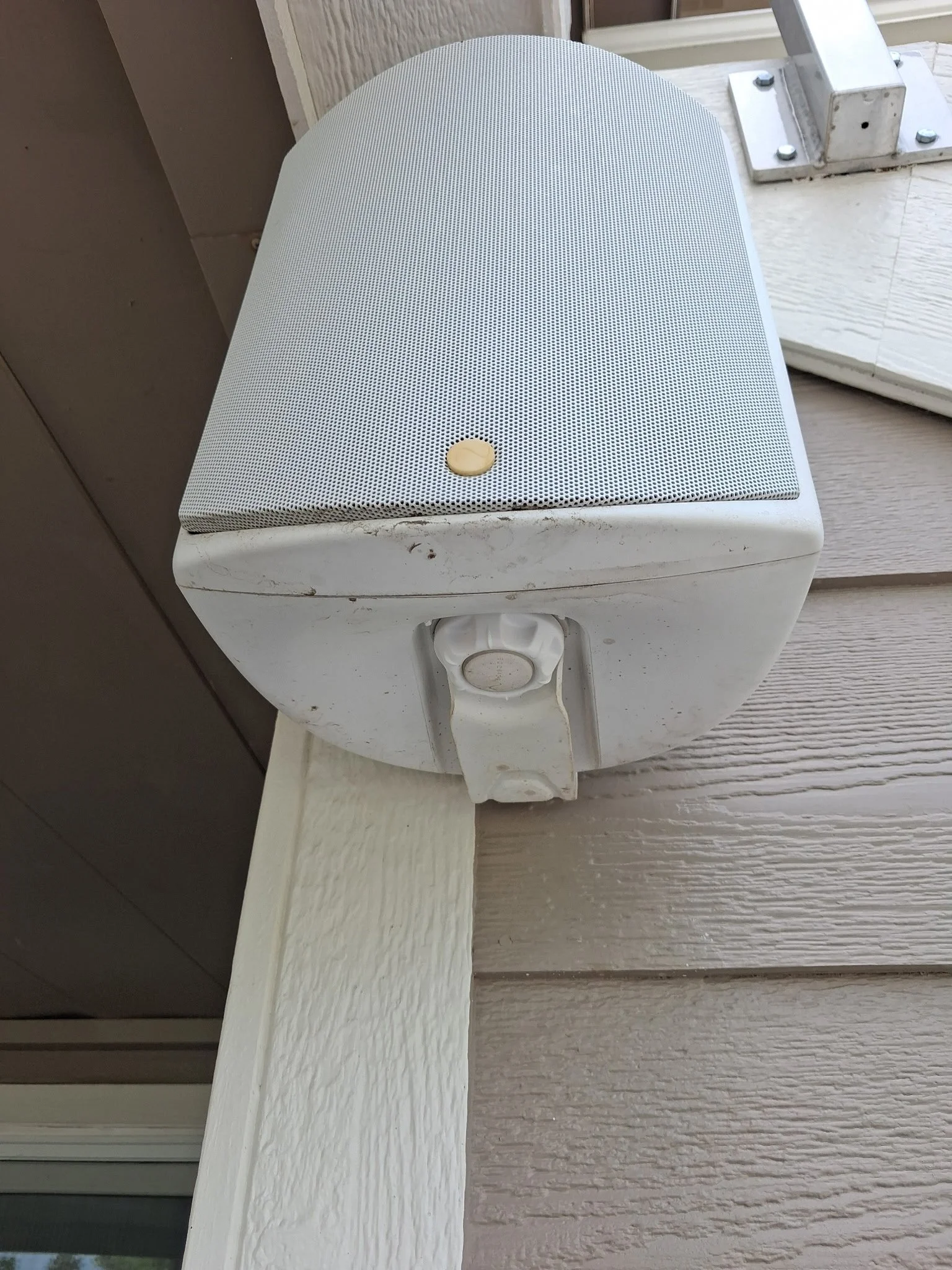 Exterior speaker detailed and cleaned by Reflect Window Cleaning (RWC) as part of residential exterior property care and maintenance.