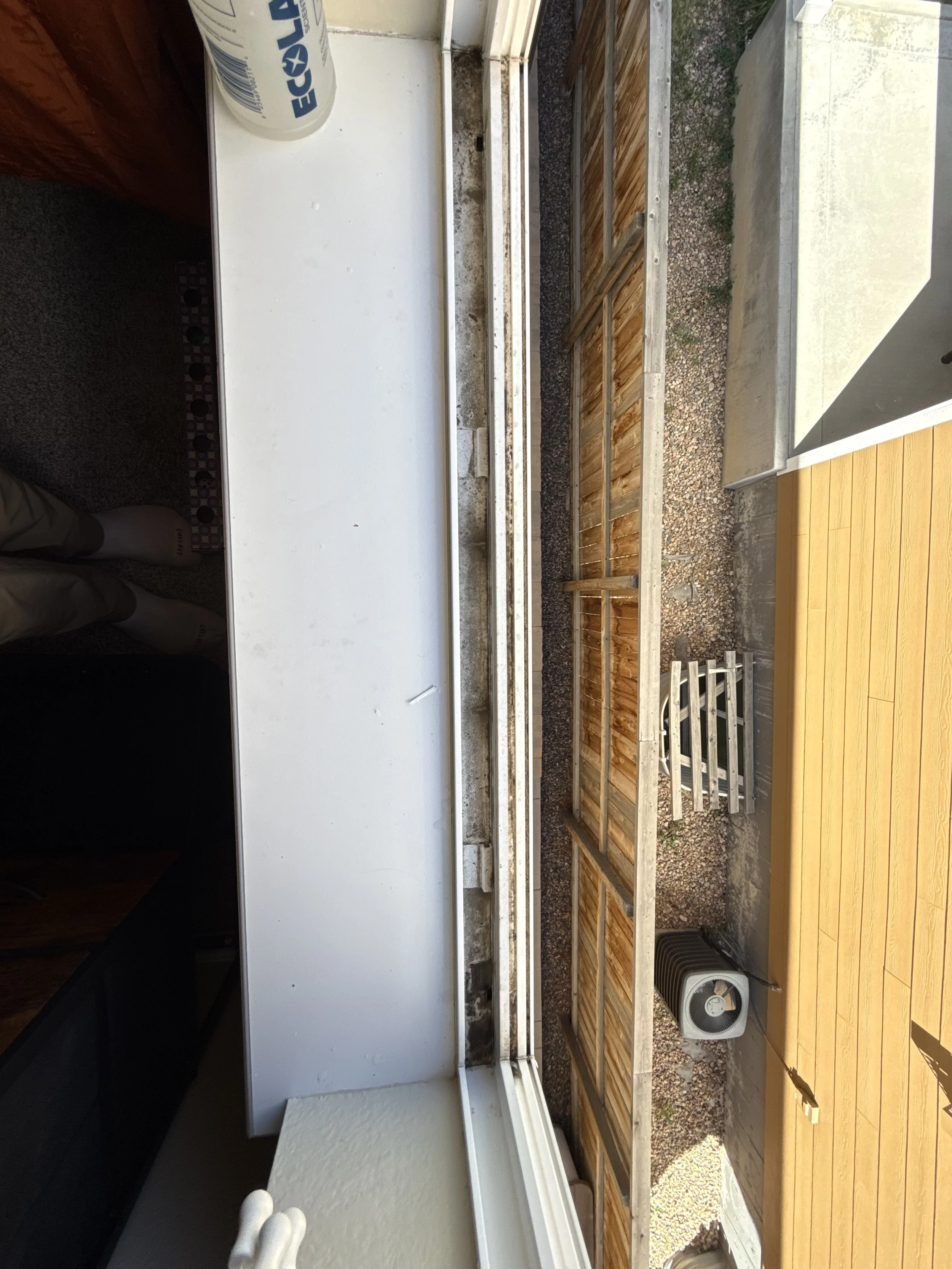 Residential exterior property care project by Reflect Window Cleaning (RWC) featuring dirty window track
