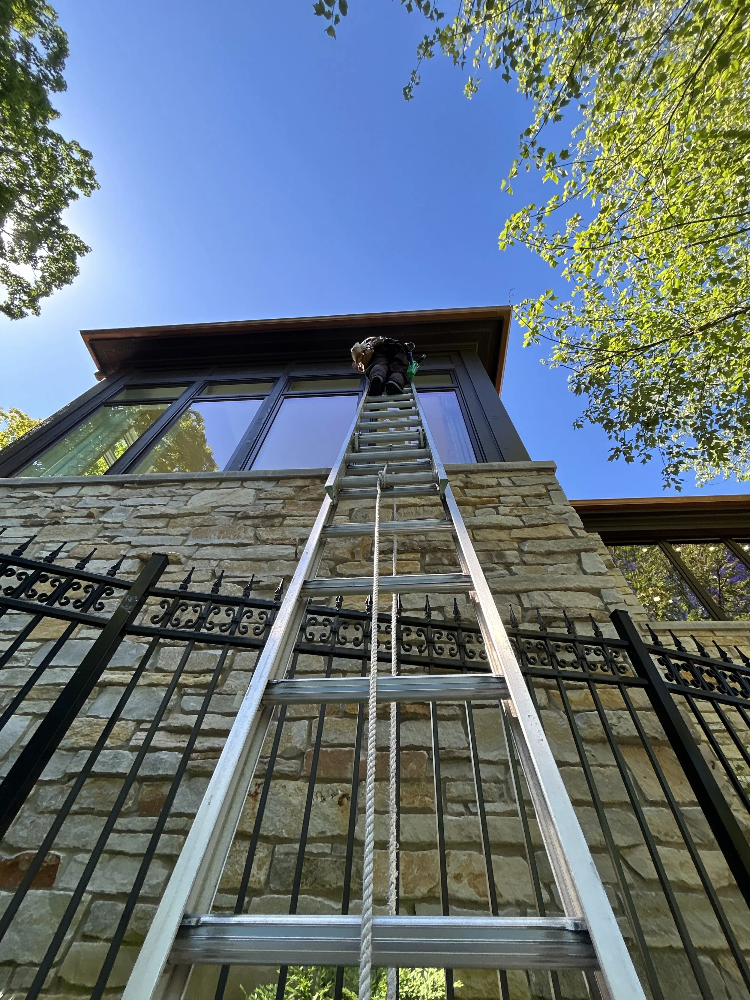 Exterior window cleaning by Reflect Window Cleaning (RWC) using a professional window cleaning method on a 3 story home. 